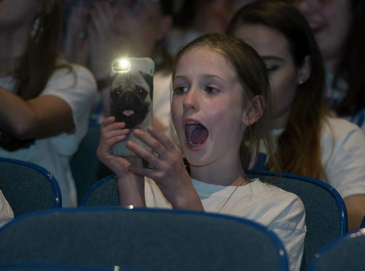 Alivia Hamlin of Latham cheers as she films the performance of Madison VanDenburg, the 17-year-old singer sensation from Latham, N.Y., on the final episode of this season's American Idol at Shaker High School on Sunday, May 19, 2019 in Latham. (Jenn March, Special to the Times Union)