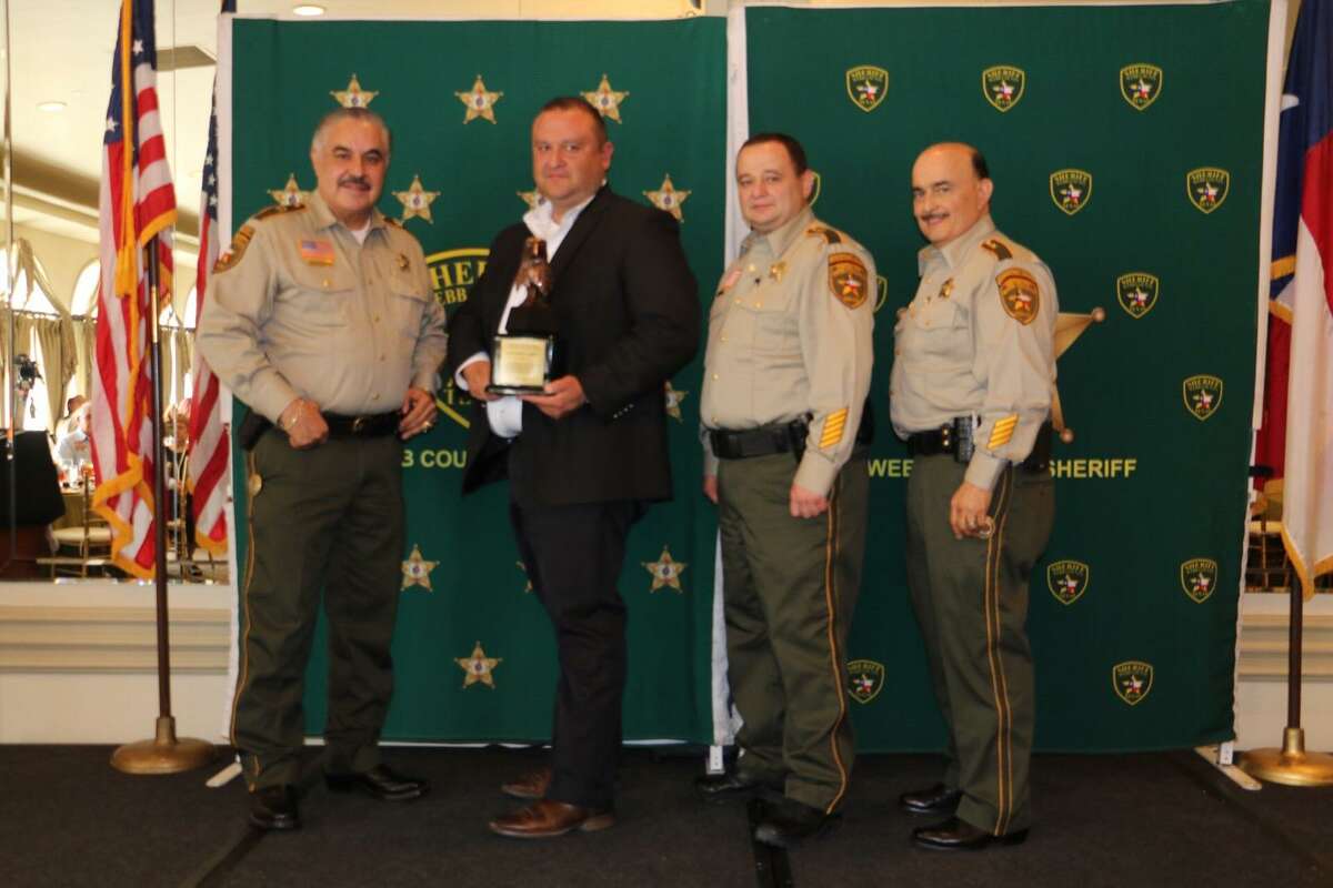 Webb County Sheriff Martin Cuellar, Assistant Chiefs J.J. Rendon and Wayo Ruiz honored Capt. Federico Calderon as the Officer of the Year.