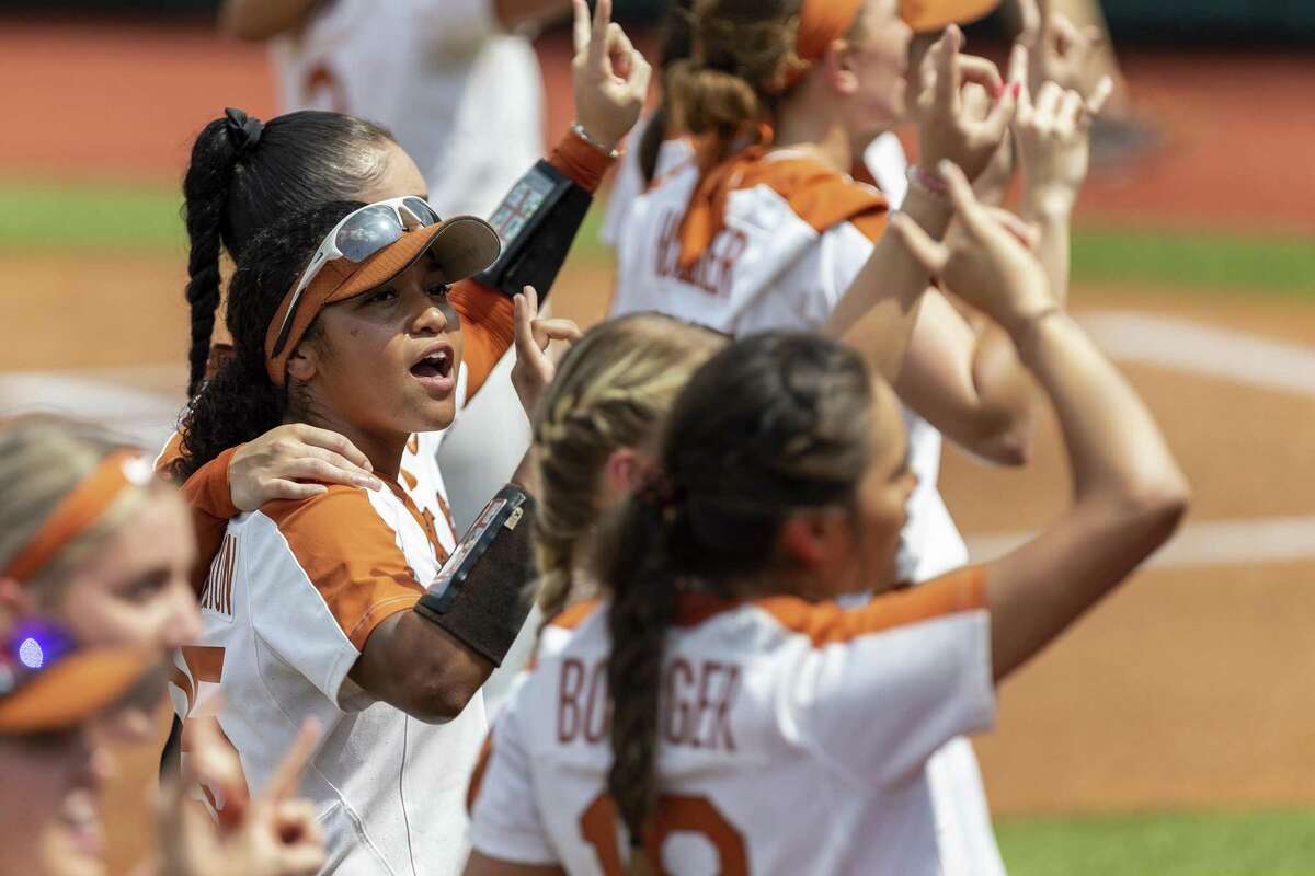 Texas left fielder Kaitlyn Washington (25) stands for the ?’Eyes of Texas?“ before an NCAA college softball tournament Austin Regional game, Sunday, May 19, 2019.(Stephen Spillman / for Express-News)