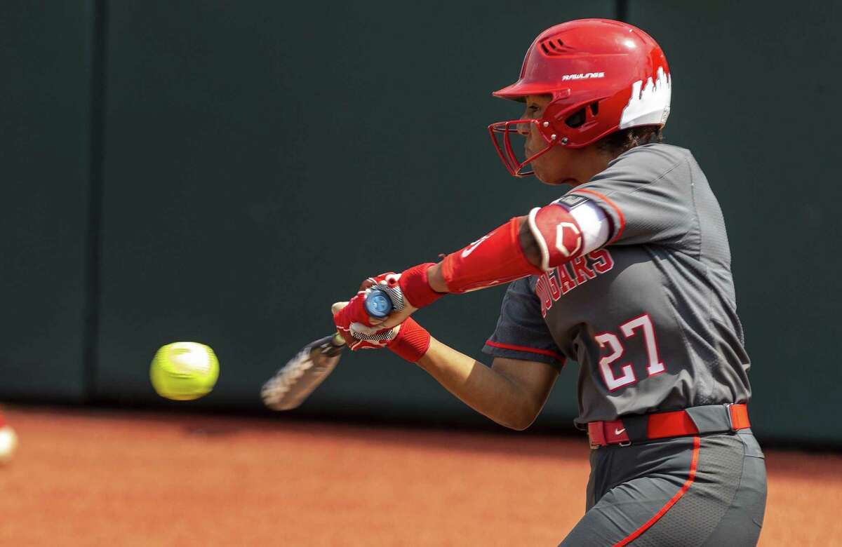 Houston batter Arielle James (27) connects for single against Texas during an NCAA college softball tournament Austin Regional game, Sunday, May 19, 2019.(Stephen Spillman / for Express-News)