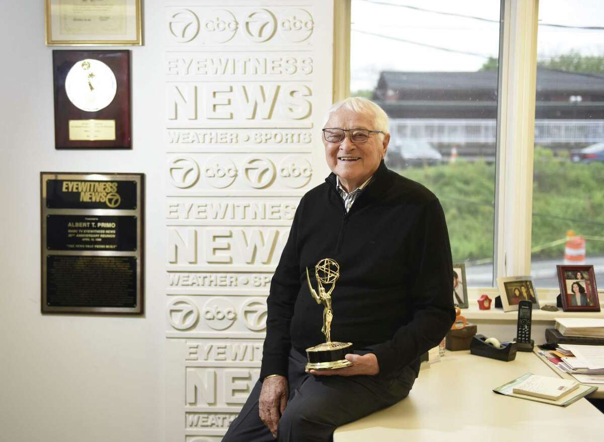 Al Primo poses with his Emmy award at the Al Primo News Services office in Old Greenwich on Monday. Primo is credited with creating the Eyewitness News format that starting giving reporters screen time in addition to just the news anchors. He recently won an Emmy for lifetime achivement in television news.
