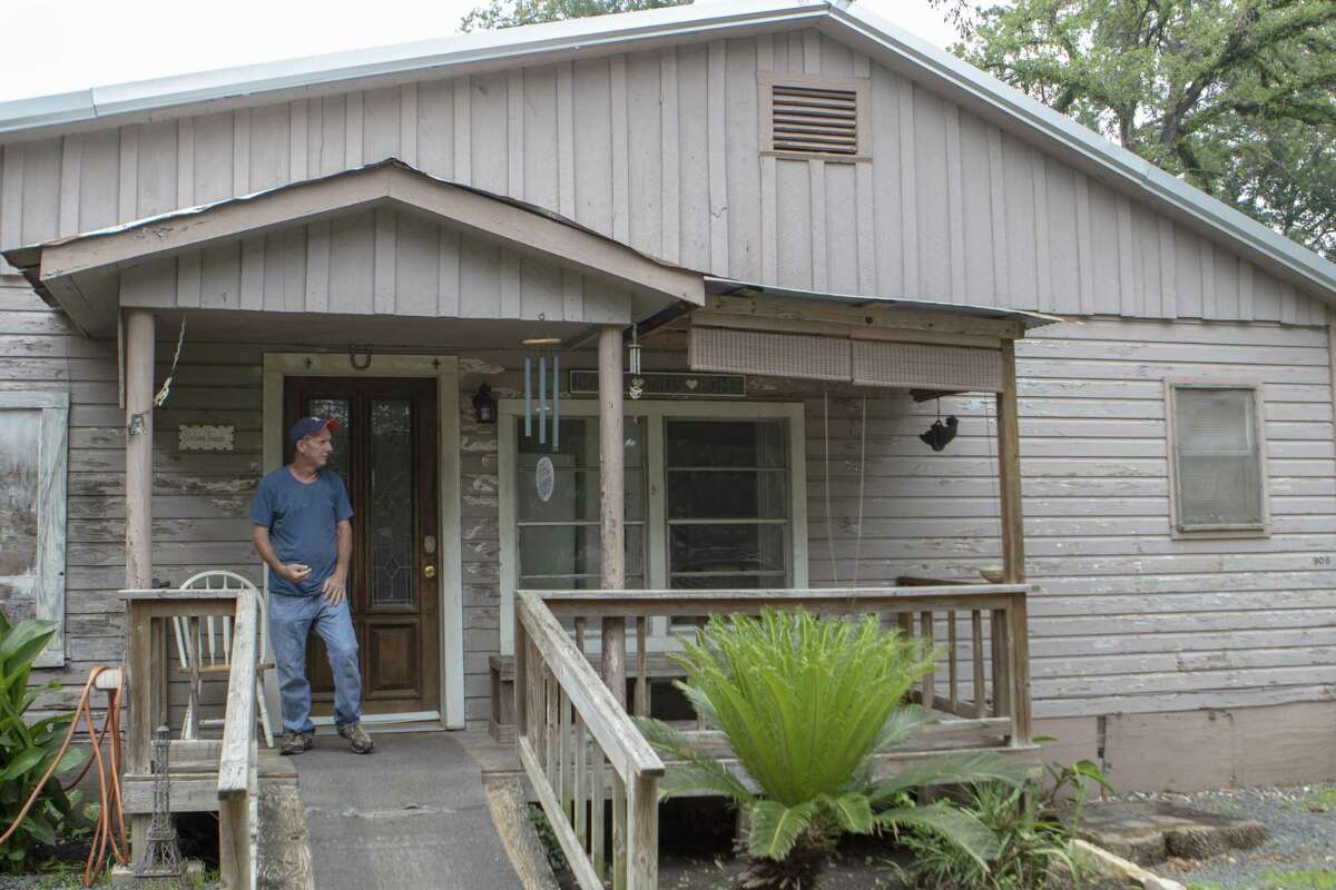 Bonnie’s House resident David Miller stands on the front porch of the house after finishing a cigarette Thursday, May 9, 2019 at Bonnie’s House in Conroe. Bonnie’s House offers recovering alcoholics and drug addicts a supportive living environment.