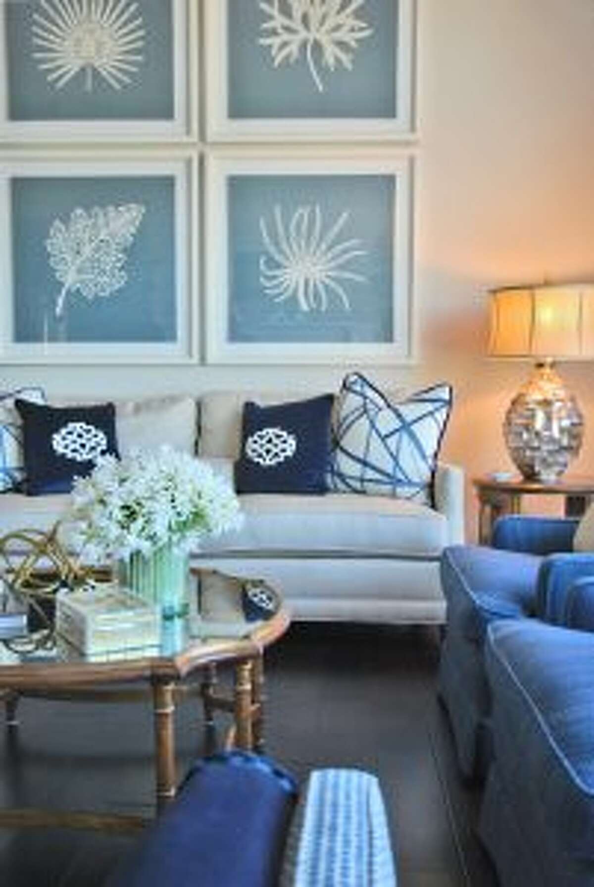 These four large scale wall art pieces, chosen for this San Diego, Calif.-based client by Jennifer Coleman, owner of JKC Designs in Ridgefield, add panache to an otherwise boring white wall. — Jennifer Coleman photo