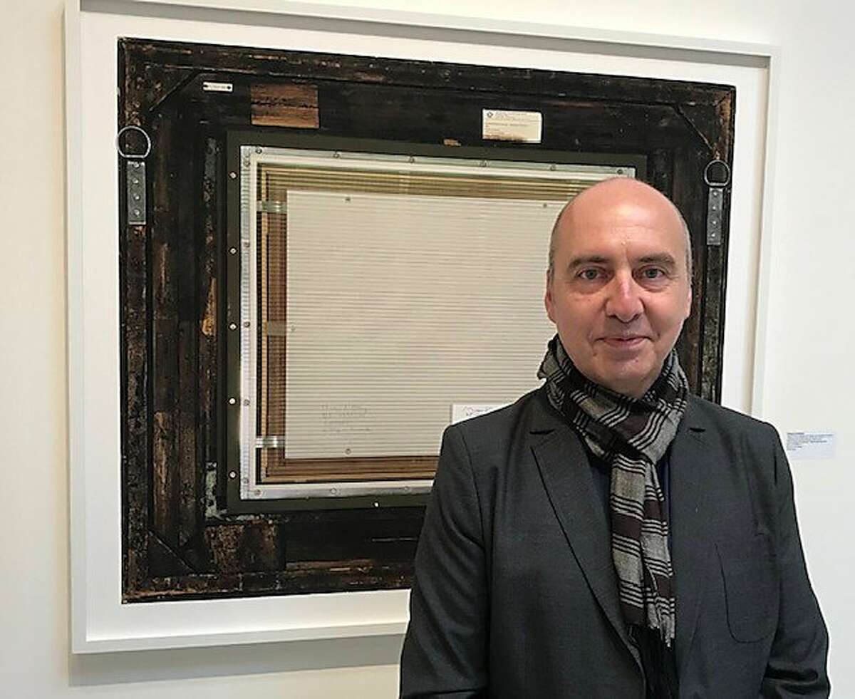 Philippe Gronon in front of the back of Courbet's 'Origin of the World'