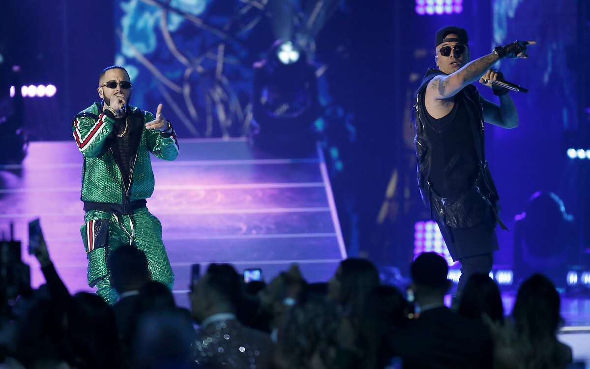 Yandel, left, and Wisin, right, of Wisin y Yandel, perform "Aullando" at the Billboard Latin Music Awards on Thursday, April 25, 2019, at the Mandalay Bay Events Center in Las Vegas. (Photo by Eric Jamison/Invision/AP)