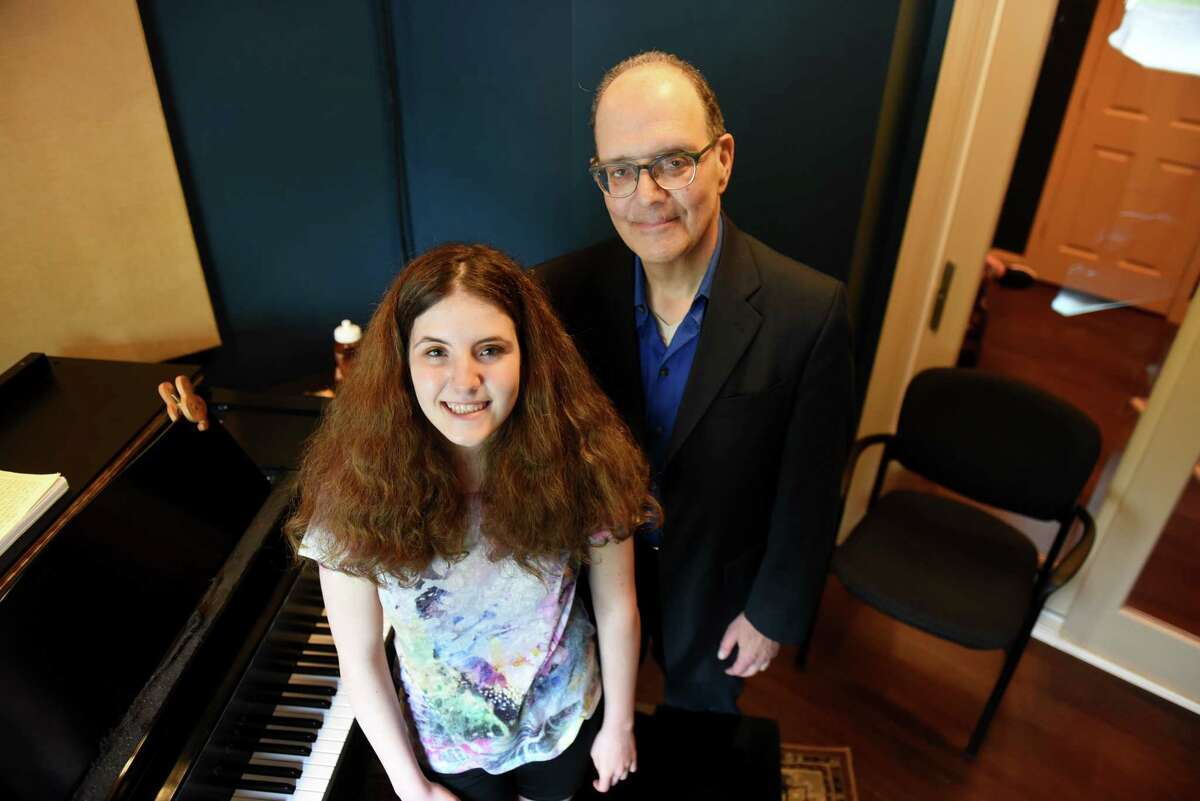 Elena Kaplan, 15, of Colonie is pictured with her father, Marc, at the Modern Day Music School on Monday, May 20, 2019, in Clifton Park, N.Y. (Will Waldron/Times Union)