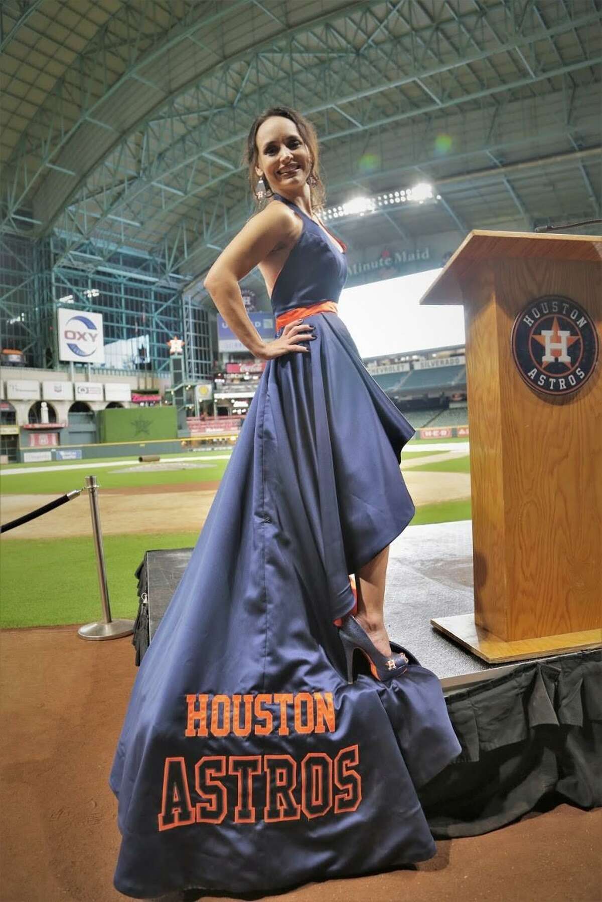 Jennifer Walsh, vice president of the Goose Creek CISD Education Foundation, shows off her Astros gown.