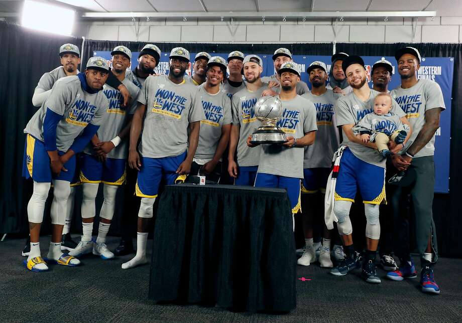 Golden State Warriors pose with the trophy after the 119-117 overtime win over Portland Trail Blazers in the fourth game of the NBA Western Conference Finals, at the Moda Center in Portland, Oregon on Monday, May 20, 2019. Photo: Scott Strazzante / The Chronicle