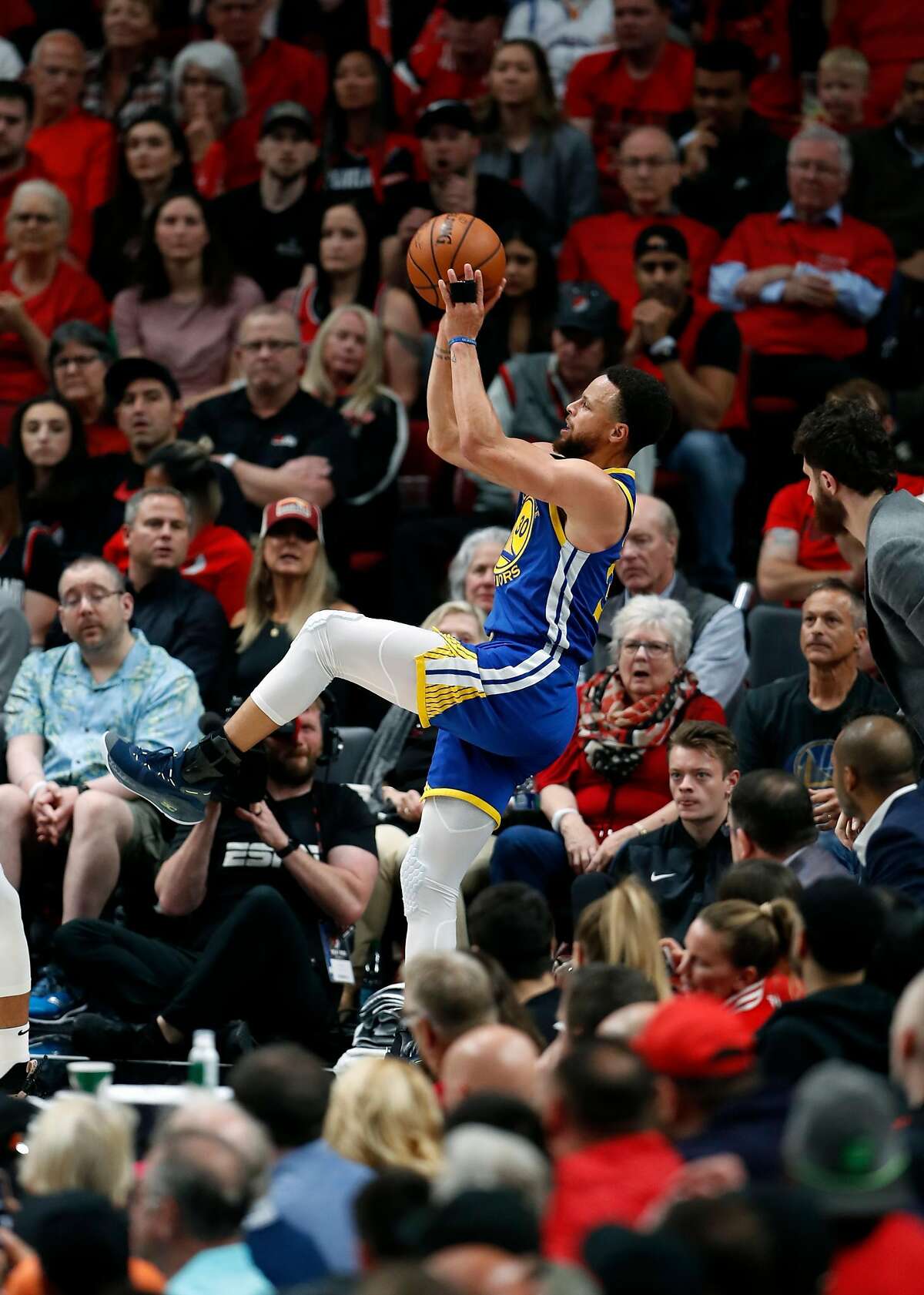 Golden State Warriors' Stephen Curry shoots a 3-pointer in 4th quarter of Warriors' 119-117 overtime win over Portland Trail Blazers in NBA Western Conference Finals' Game 4 at Moda Center in Portland, Oregon on Monday, May 20, 2019.