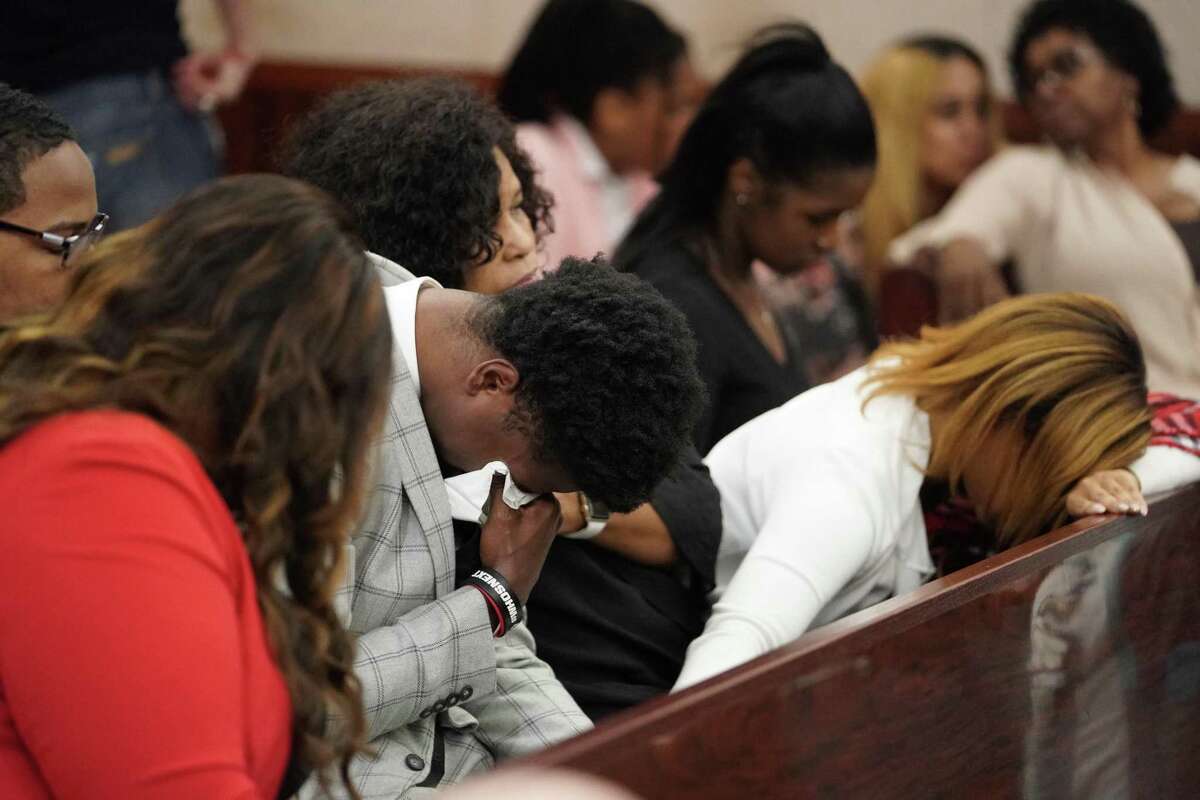 Antonio Armstrong, Jr. is surrounded by family as he waits in the courtroom after a mistrial was declared in his capital murder trial Friday, April 26, 2019 in Houston. He was accused of killing his parents, Dawn Armstrong and Antonio Armstrong, Sr., on July 29, 2016 as they slept in their Bellaire-area home.