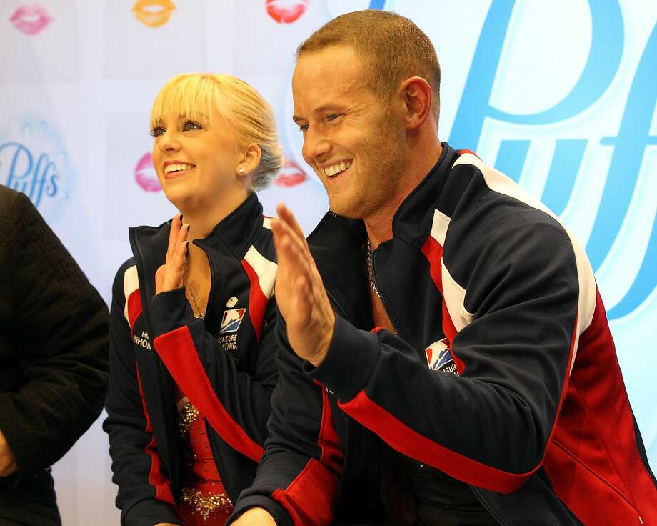 FEATURE - Caydee Denney and John Coughlin of the United States are sitting after participating in the paired short program of the second day at Skate America at the Joe Louis Arena on October 19, 2013 in Detroit, Michigan. Bridget Namiotka (not shown), a former partner of John Coughlin, the figure skater who committed suicide in January, accused her of having 