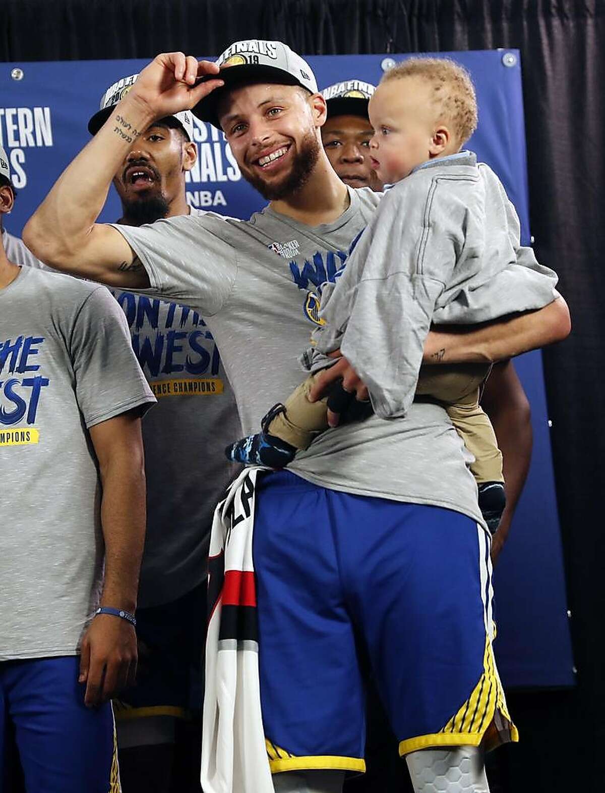 Golden State Warriors' Stephen Curry with son, Canon, after 119-117 overtime win over Portland Trail Blazers' in NBA Western Conference Finals' Game 4 at Moda Center in Portland, Oregon on Monday, May 20, 2019.