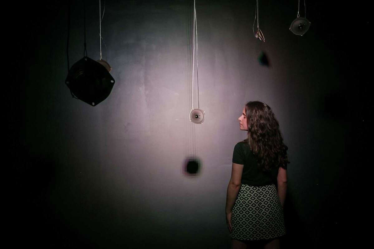 Artist Lina Dib poses within her sound installation "North to South and Back," which is up through June 9 at Space HL.