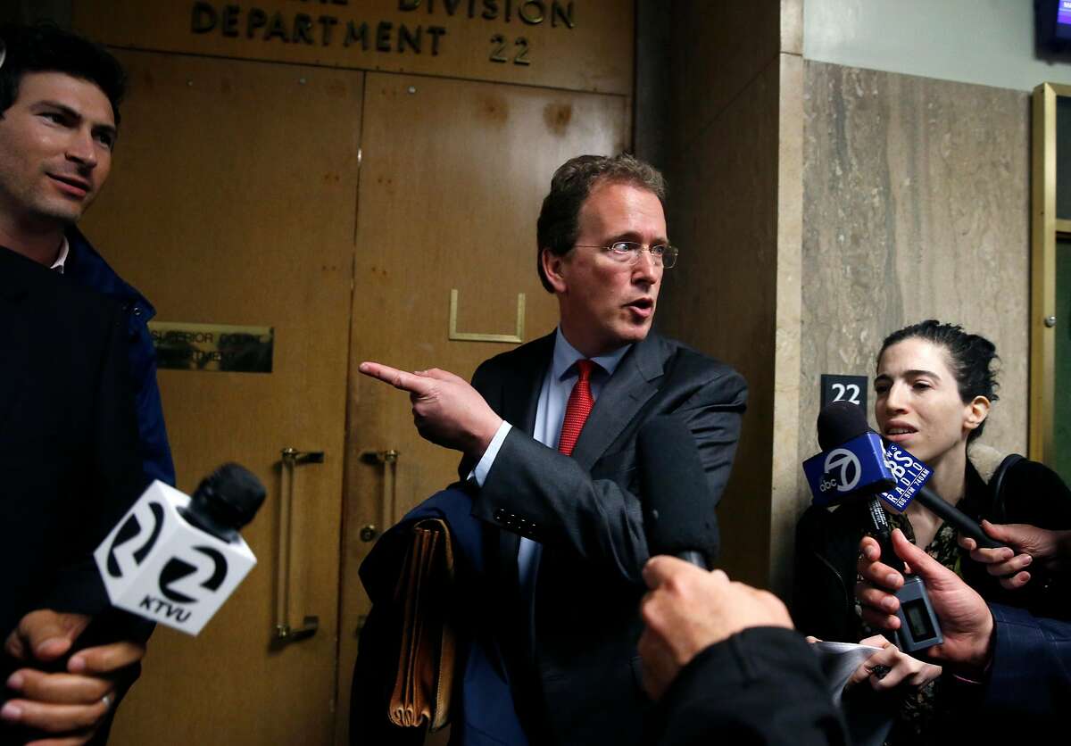 Thomas R. Burke, an attorney representing freelance videographer Bryan Carmody, leaves Department 22 after a hearing at the Hall of Justice in San Francisco, Calif. on Tuesday, May 21, 2019 to hear arguments in a motion filed to quash a search warrant and seizure of equipment from Carmody. Police officers obtained the warrant to search Carmody's home after he sold a leaked confidential police report on the death of public defender Jeff Adachi to television news outlets.