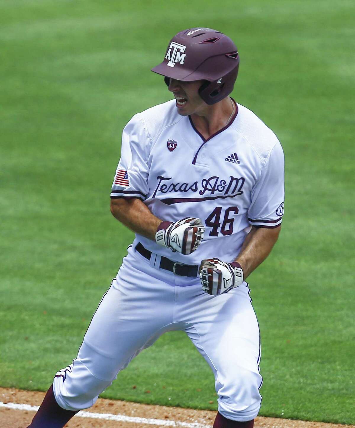 Texas A&M's Jonathan Ducoff reacts after hitting a three run homer during the eighth inning of the Southeastern Conference tournament NCAA college baseball game against Florida, Tuesday, May 21, 2019, in Birmingham, Ala. (AP Photo/Butch Dill)