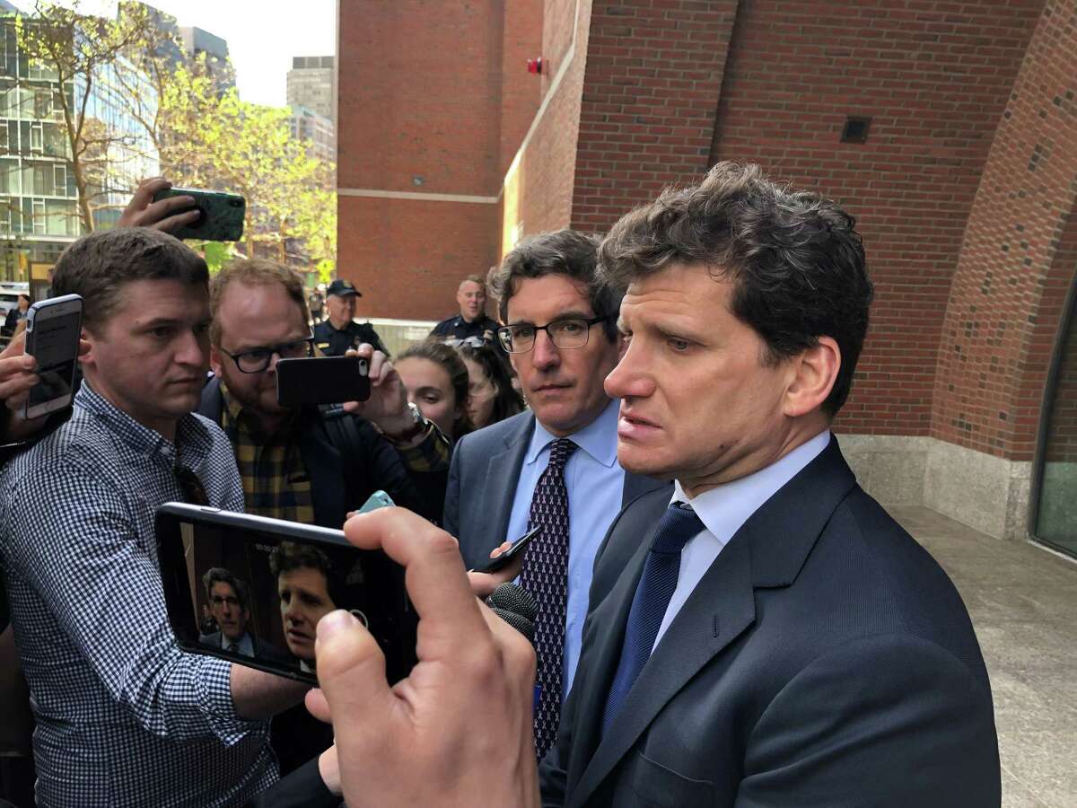Greenwich lawyer Gordon Caplan leaves the federal courthouse in Boston after entering his guilty plea May 21 in the college admissions cheating scandal.