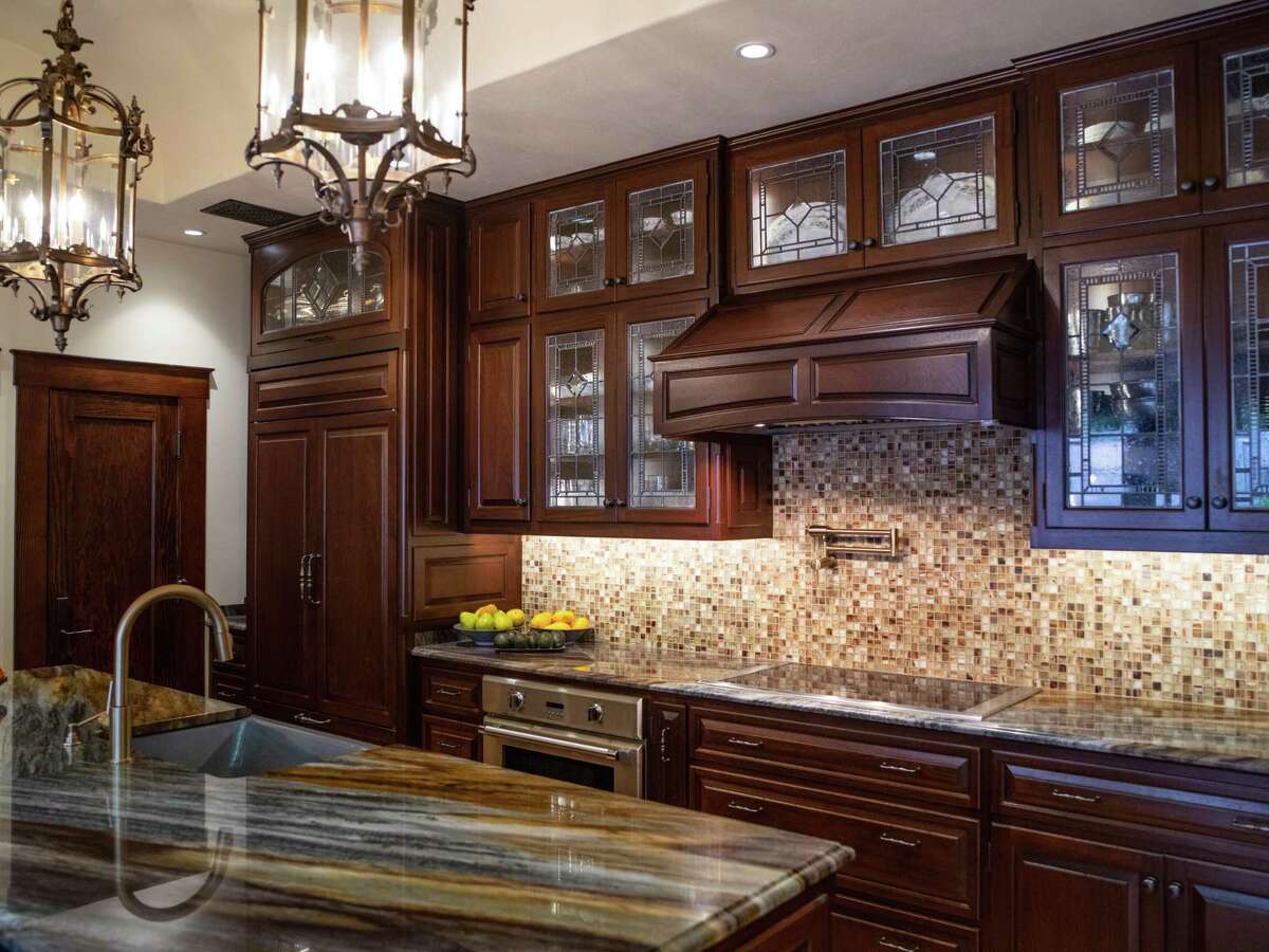The original plan for the kitchen was just to put in new kitchen countertops, but it became a whole redo with 1-foot bump out to accommodate a new island.