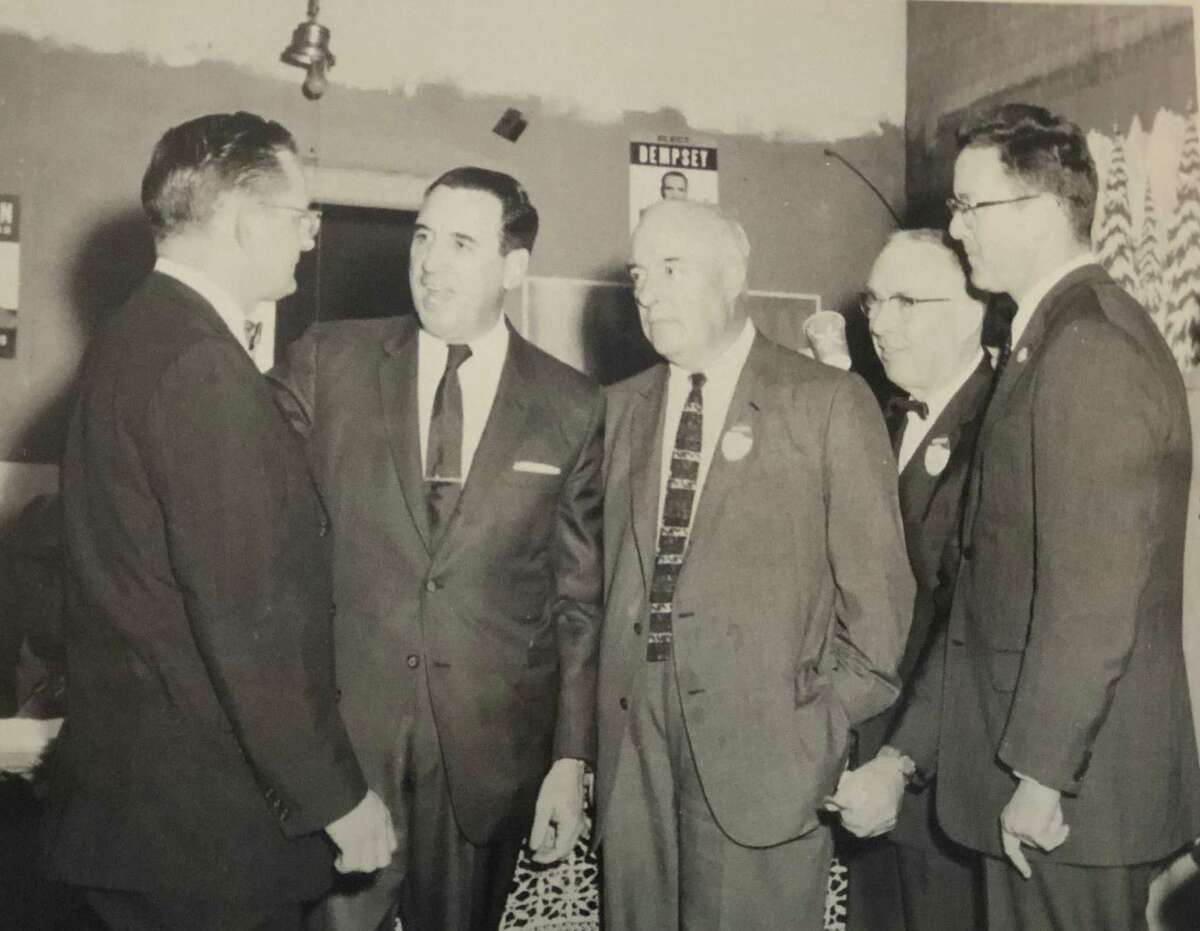 This picture captures a moment on April 15, 1960, at the New Milford headquarters for state election. Shown are, from left to right, Truman T. Richmond, chairman of the Democratic committee, the Honorable John N. Dempsey, governor, Judge Harry B. Bradbury, First Selectman E. Paul Martin and Donald Irving, aide to the governor. If you have a