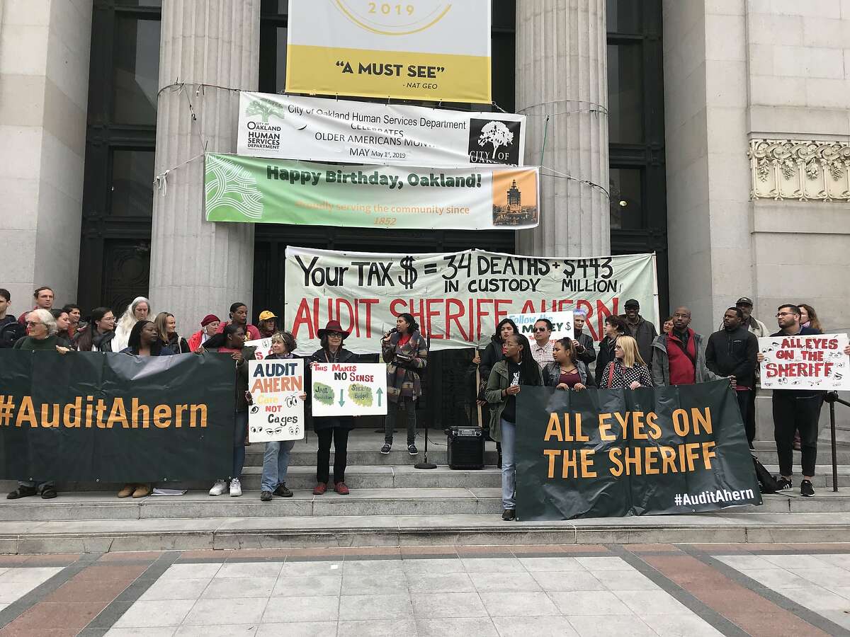 A group of people rally outside Oakland City Hall calling for an independent audit of the Alameda County Sheriff's Office. The City Council approved a resolution calling for the audit as pressure mounts on the department.