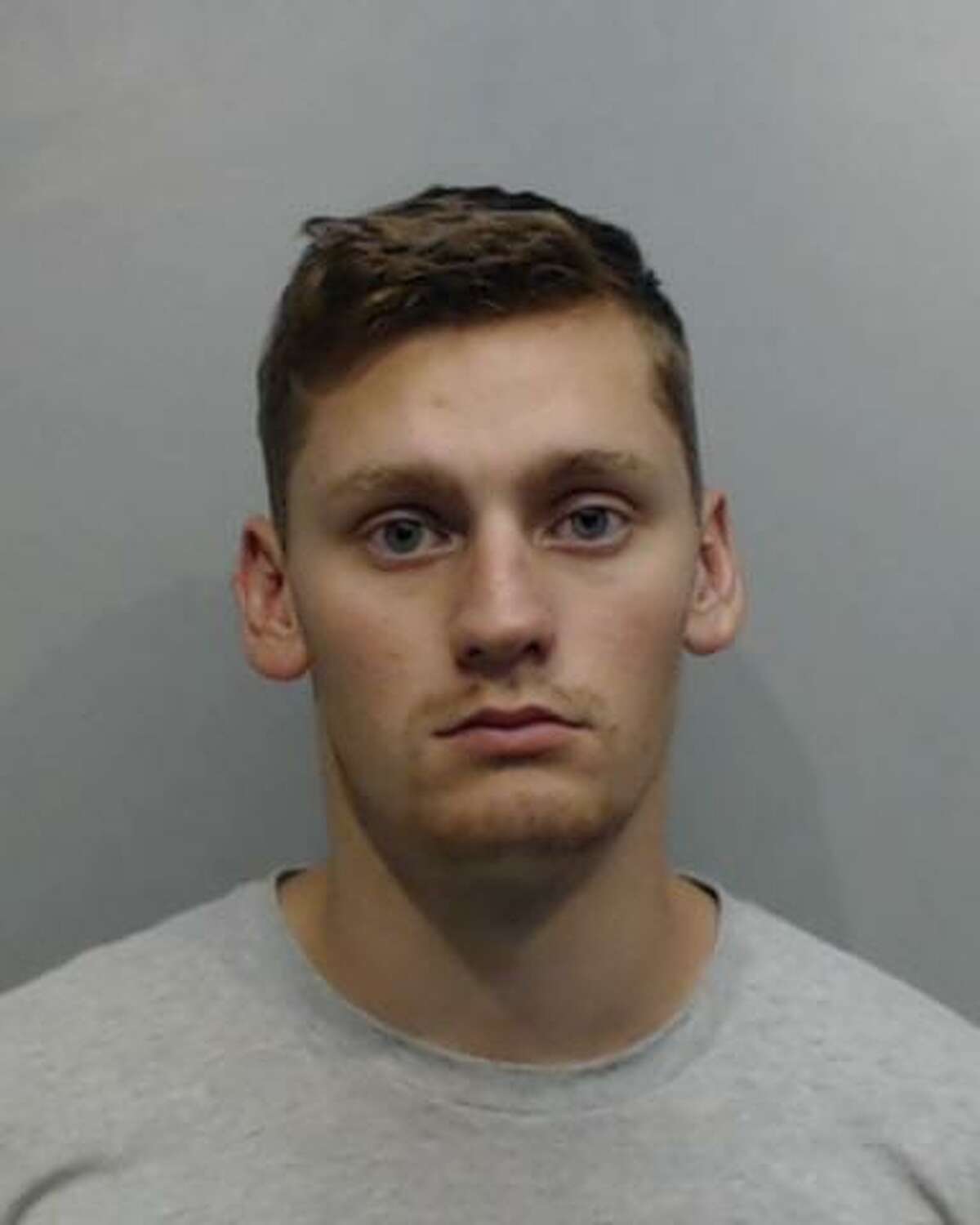 Dominick Burns, 20, is seen May 21, 2019, in a booking photo after he was extradited to the Hays County Sheriff’s Office. Burns is one of five U.S. Navy servicemen charged with four counts of aggravated sexual assault related to an incident that allegedly occurred on May 19, 2018 in San Marcos.