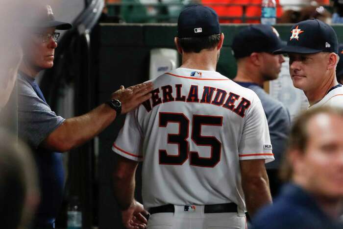 Houston Astros' Jake Marisnick (6) gets a high five from starting pitcher  Justin Verlander (35) in the dugout after Marisnick's home run during the  seventh inning of a baseball game against the
