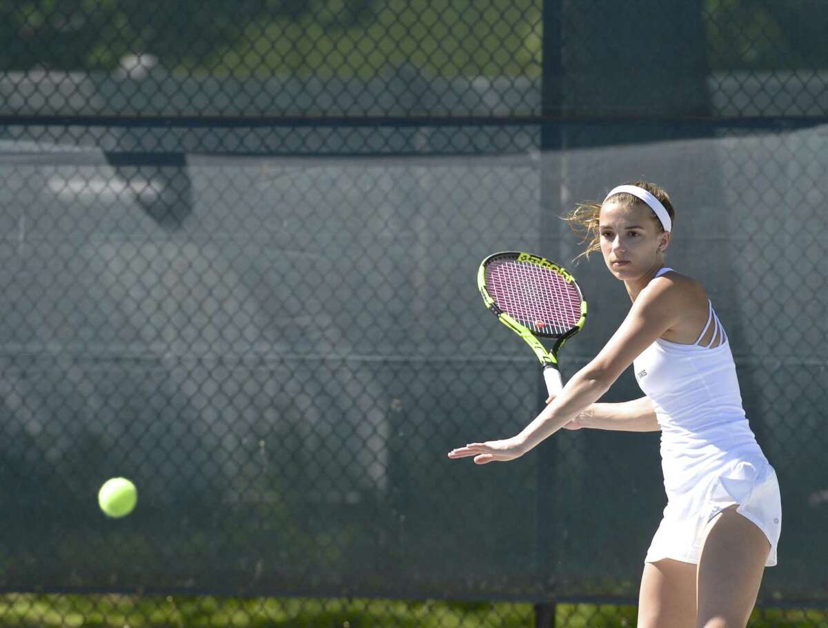 Wilton's number one Izzy Koziol warms up before her FCIAC girls tennis finals match with Staples Allyssa Dimaio. Tuesday, May 21, 2019, at Wilton High School, Wilton, Conn.