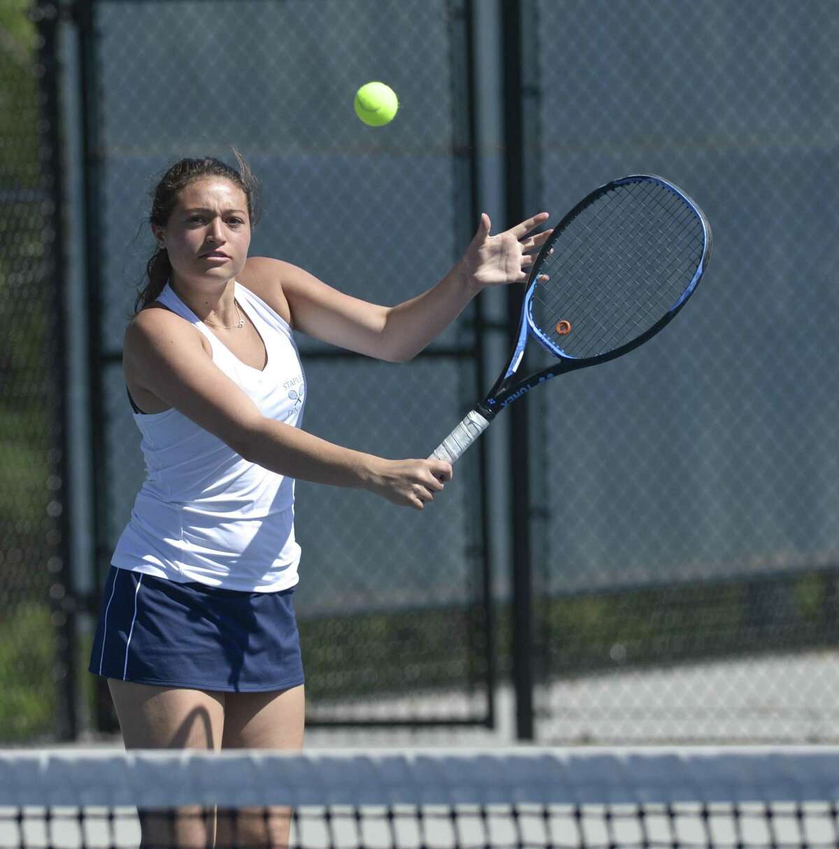 Staples’ No. 1 Allyssa Dimaio warms up before her FCIAC girls tennis finals match with Wilton's Izzy Koziol. Tuesday, May 21, 2019, at Wilton High School, Wilton, Conn.