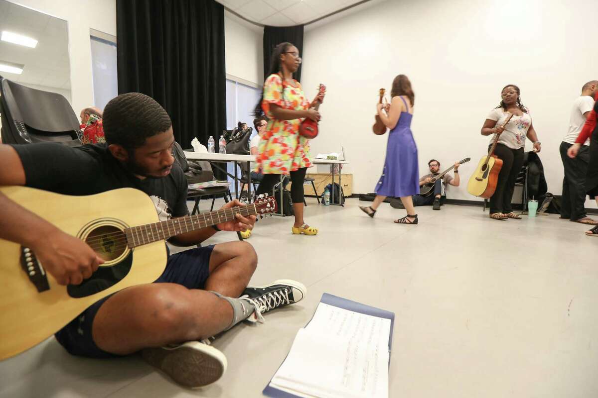 Chuck Vaughn plays his guitar before rehearsal for the upcoming rock opera 'Speeding Motorcycle' at the Catastrophic Theater at MATCH Monday, May 20, 2019, in Houston.