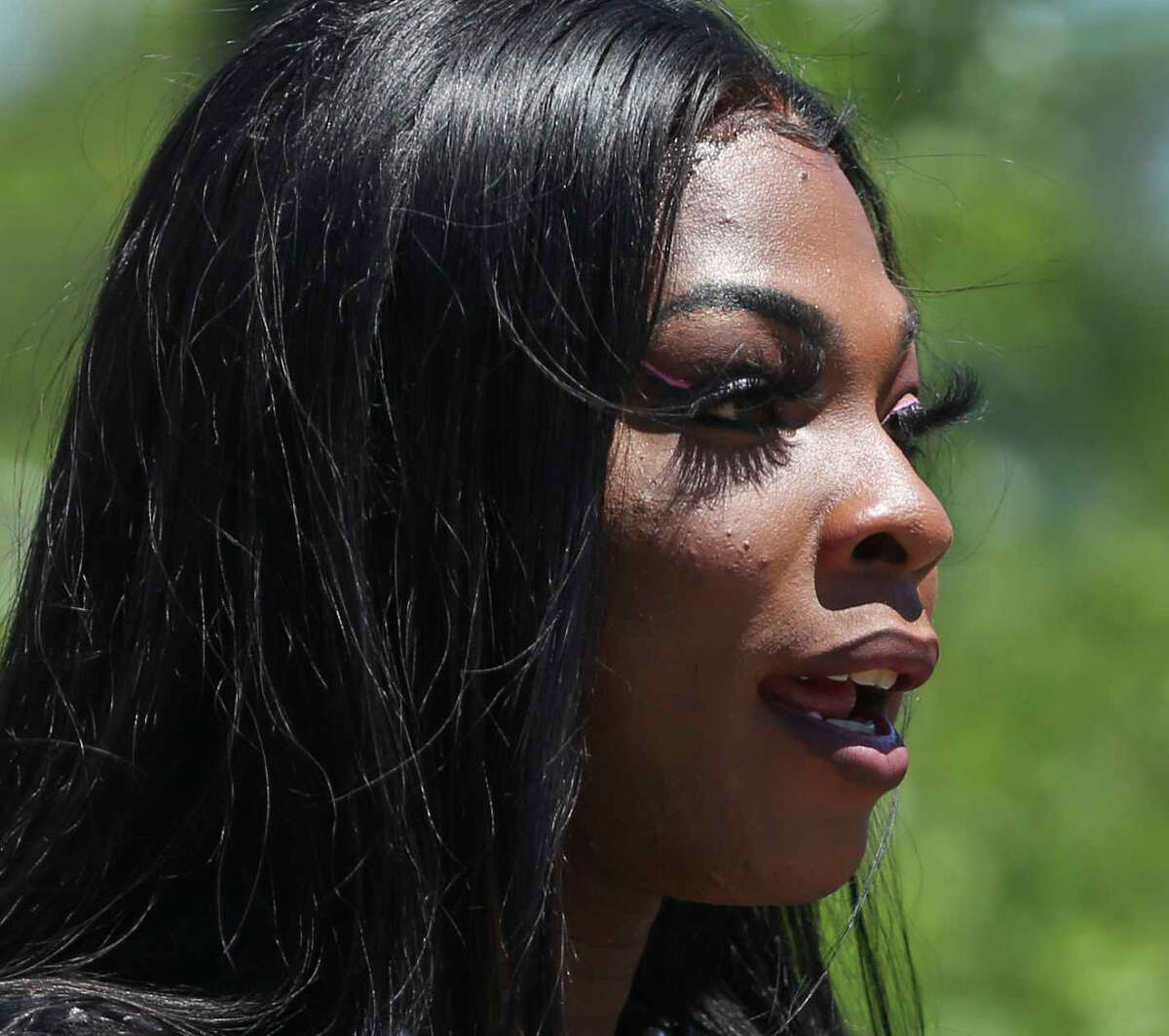In this Friday, April 20, 2019 photo, Muhlaysia Booker speaks during a rally in Dallas. Booker, a transgender woman seen on a widely circulated video being beaten on April 12 in front of a crowd of people, was found dead Saturday, May 18 in a Dallas shooting. No suspect has been identified. (Ryan Michalesko/The Dallas Morning News via AP)