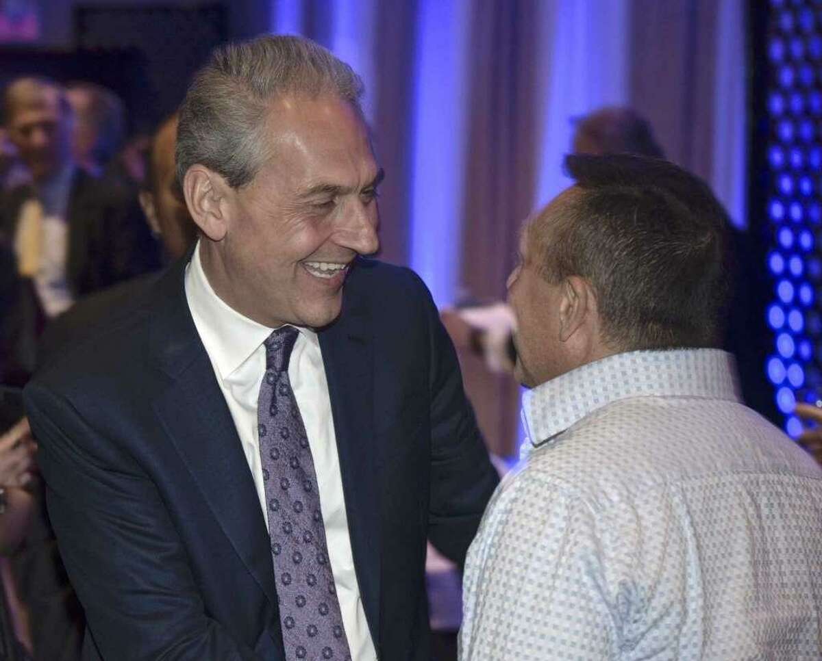 Democrat Chris Setaro greets Peter Tragni, of Waterbury, during his official campaign kick off event to announce his run for Danbury's mayor. Thursday, January 17, 2019, at the Amber Room Colonnade, Danbury, Conn.