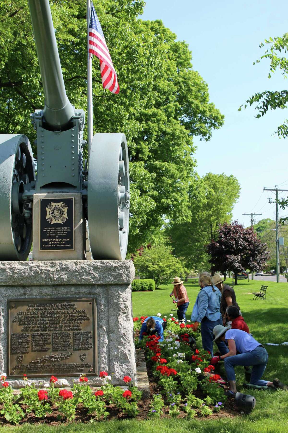 Norwalk Garden Club plants the green red, white and blue for Memorial Day