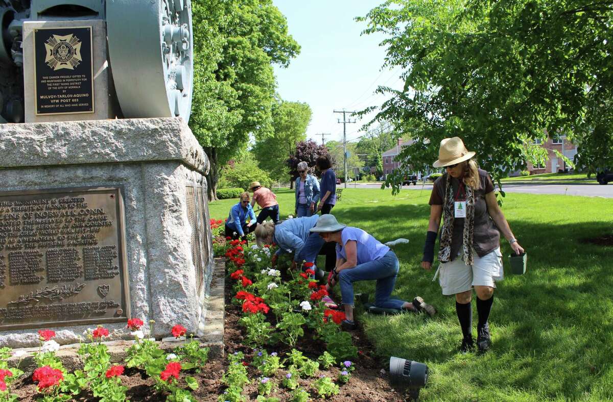 Norwalk Garden Club plants the green red, white and blue for Memorial Day