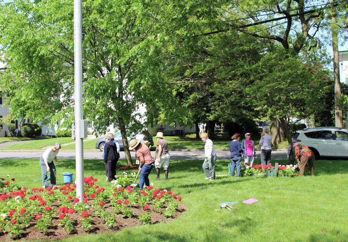 Norwalk Garden Club plants the green red, white and blue for Memorial Day