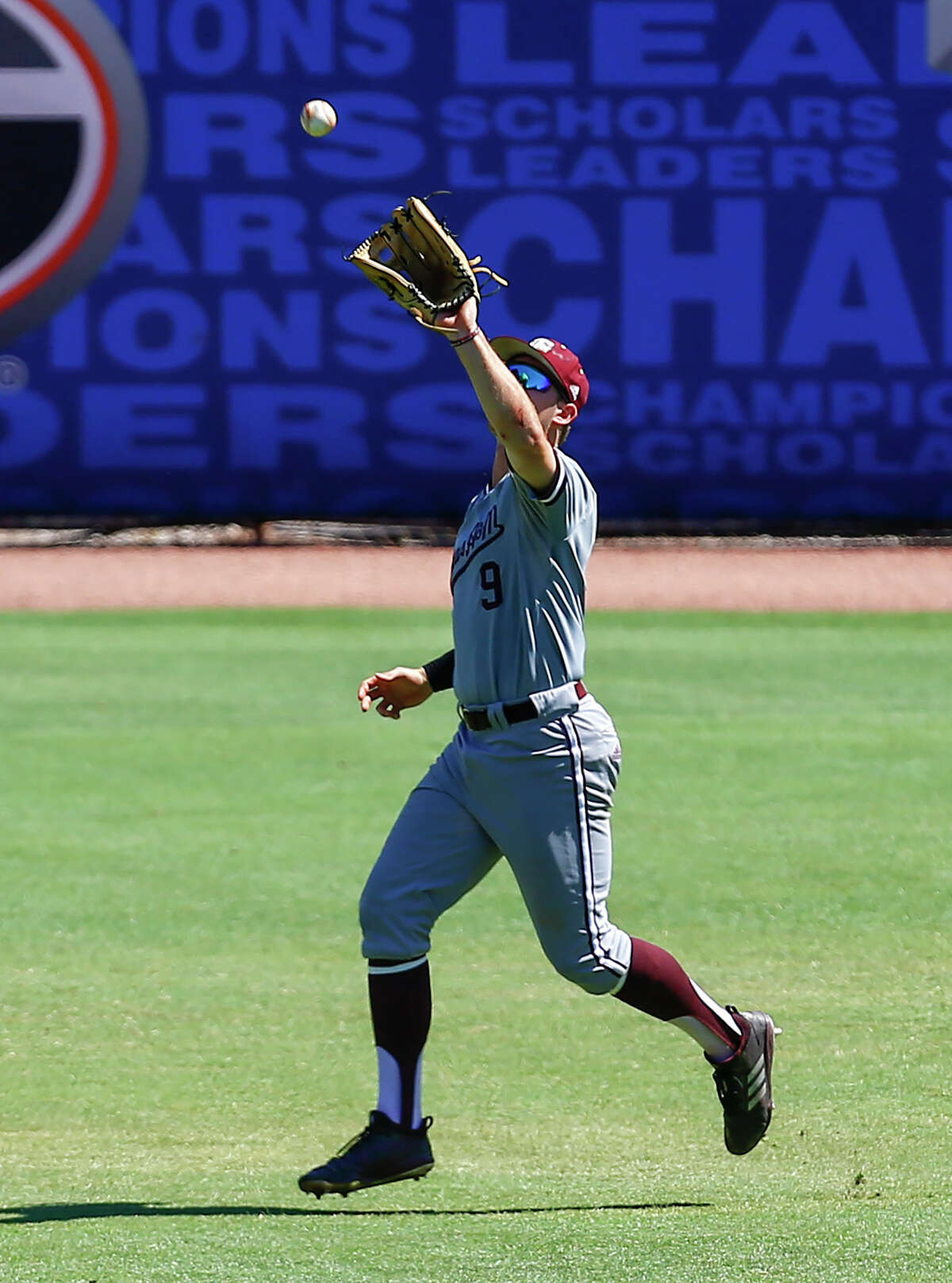 Texas A&M center fielder Zach Deloach catches a pop fly for the out on Georgia's Tucker Maxwell during the third inning of the Southeastern Conference tournament NCAA college baseball game, Wednesday, May 22, 2019, in Hoover, Ala. (AP Photo/Butch Dill)