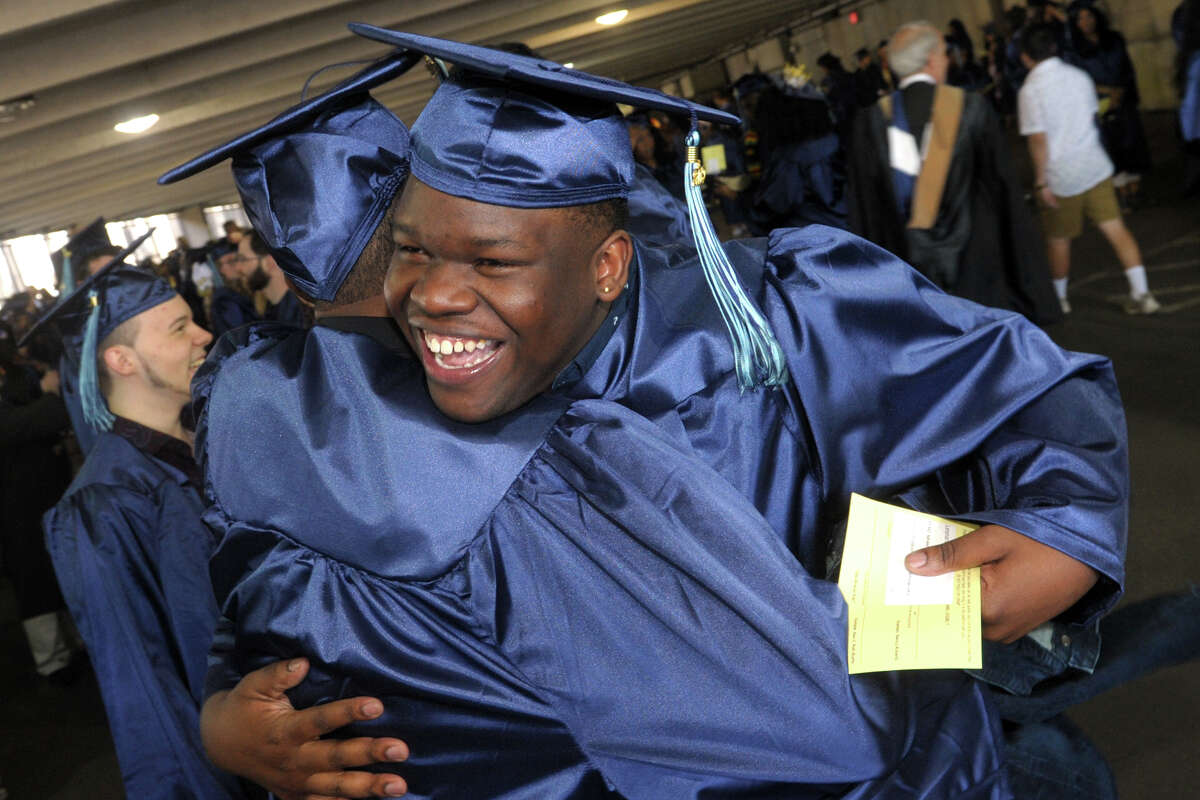 Leo Taylor, of Bridgeport, greets a fellow grad during Commencement for the Housatonic Community College Class of 2019, held at Webster Bank Arena in Bridgeport, Conn. May 22. 2019.