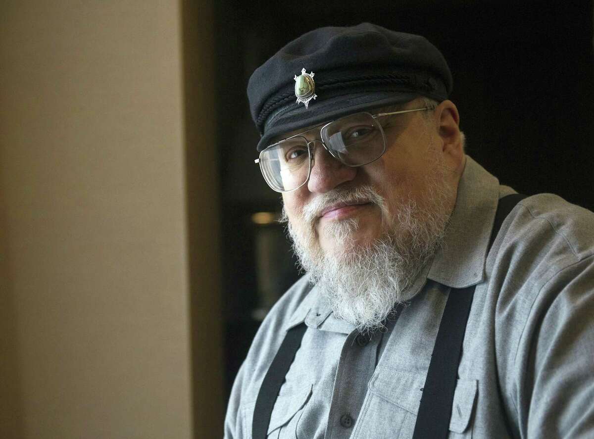 FILE - In this March 12, 2012 file photo, George R.R. Martin, author of the popular book series "A Song of Ice and Fire," poses in Toronto. The author whose work was adapted into the HBO’s series "Game of Thrones," which drew a record-setting numbers of viewers for its finale on Sunday, May 19, 2019, says it’s “been a wild ride.” Martin wrote on Monday, May 20 that it “was an ending, but it was also a beginning.” The 70-year-old says he’s working on the next installment, “The Winds of Winter.” (Nathan Denette/The Canadian Press via AP, File)