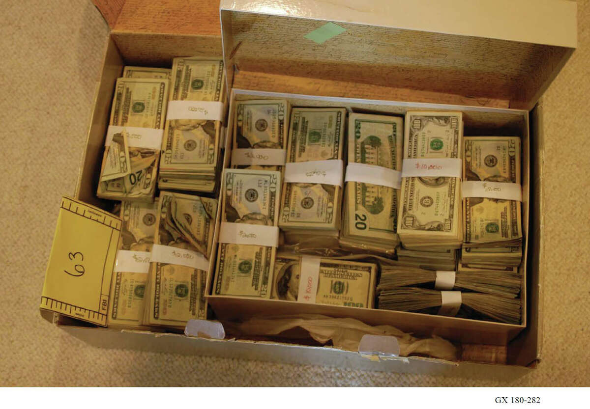Evidence photos show some of the evidence, including more than $520,000 in cash, that federal task force members retrieved from NXIVM President Nancy Salzman’s residence on Oregon Trail in Halfmoon, N.Y., in March 2018. (U.S. Department of Justice)