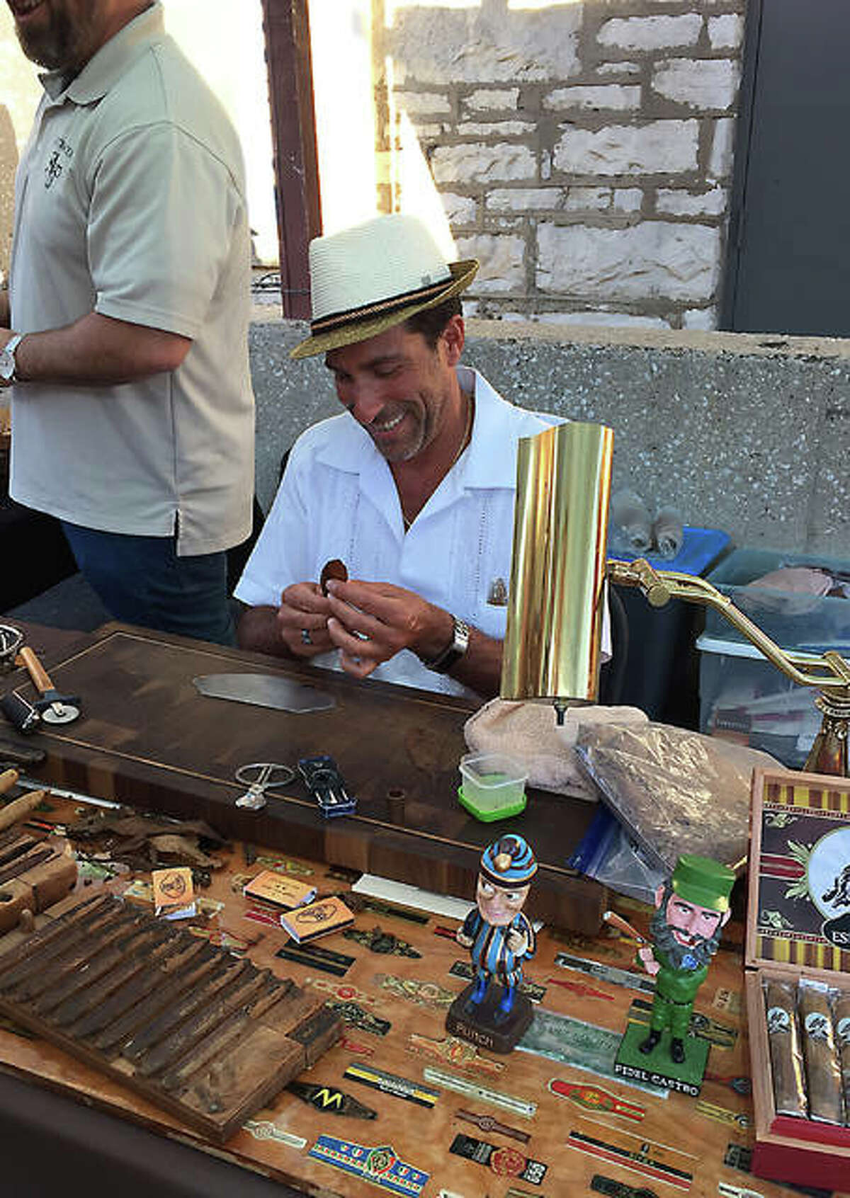 Scott Biancardi of STL Cigars is seen hand-rolling cigars during the first Hand Rolled Cigar Networking Event in 2017 outside of Bluff City Grill on Broadway in Alton. This year marks the third year for the event presented by Derrick and Kathleen Richardson of Alton.