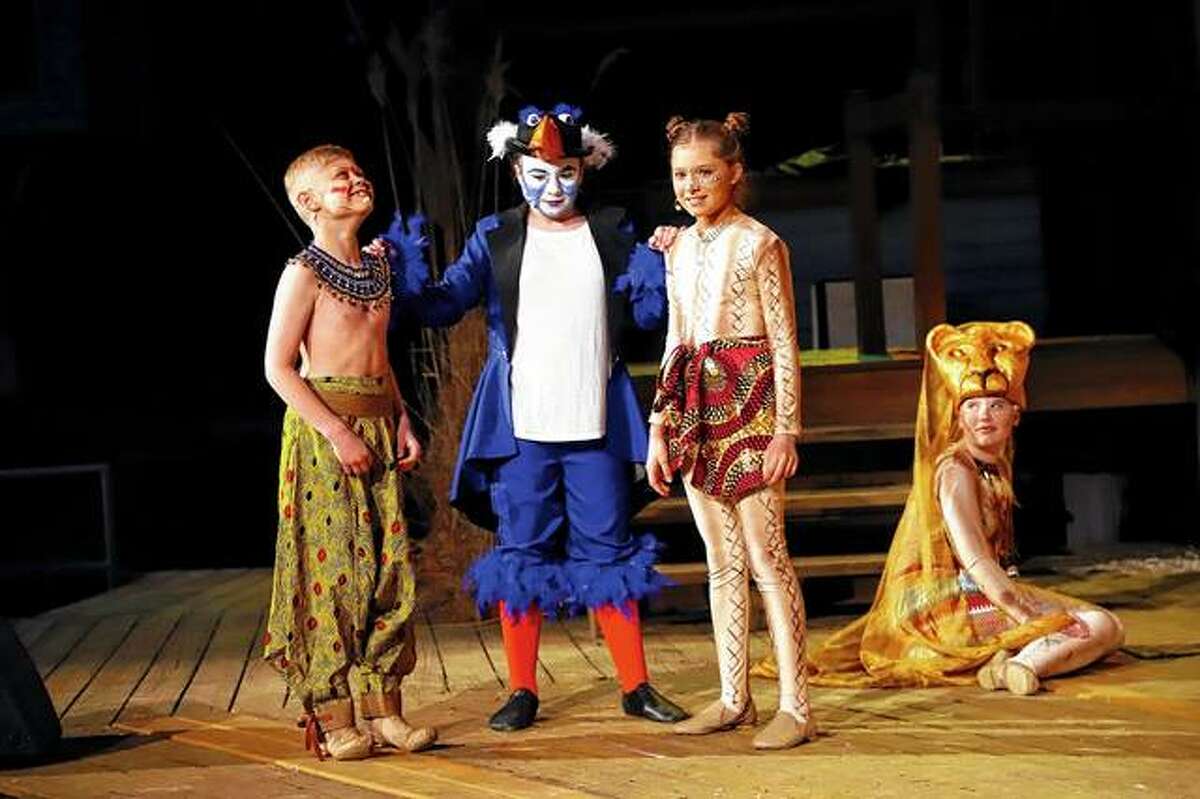Cast members Jake Schwartz (from left) as young Simba, Kaydence Daley as ZaZu, Adelyn Rollins as young Nala and Kristin Dennison as a lioness, rehearse a scene from Theatre in the Park’s take on Disney’s “The Lion King Jr.” The play’s run at the theater at Lincoln’s New Salem State Historic Site in Petersburg continues this weekend with performances at 8 p.m. today, Friday and Saturday. A free preshow will begin at 7 p.m. nightly. Tickets, which are $15 for adults, $13 for seniors and $10 for children under 12, are available online at theatreinthepark.net or by calling 217-632-5440.
