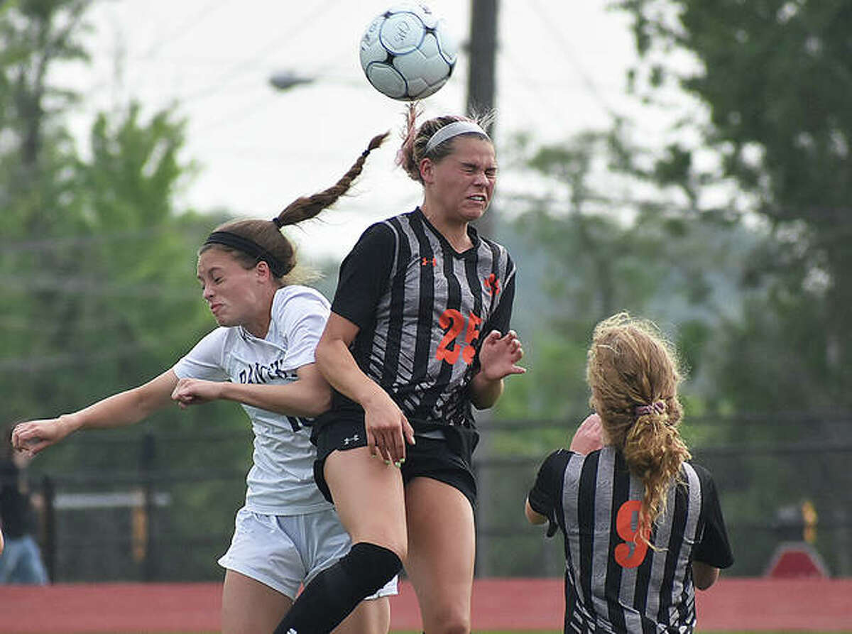 Edwardsville’s Hannah Bielicke goes up for a header on a 50-50 ball at midfield during the first half of Tuesday’s game against O’Fallon in the Class 3A Moline Sectional semifinals in Collinsville.