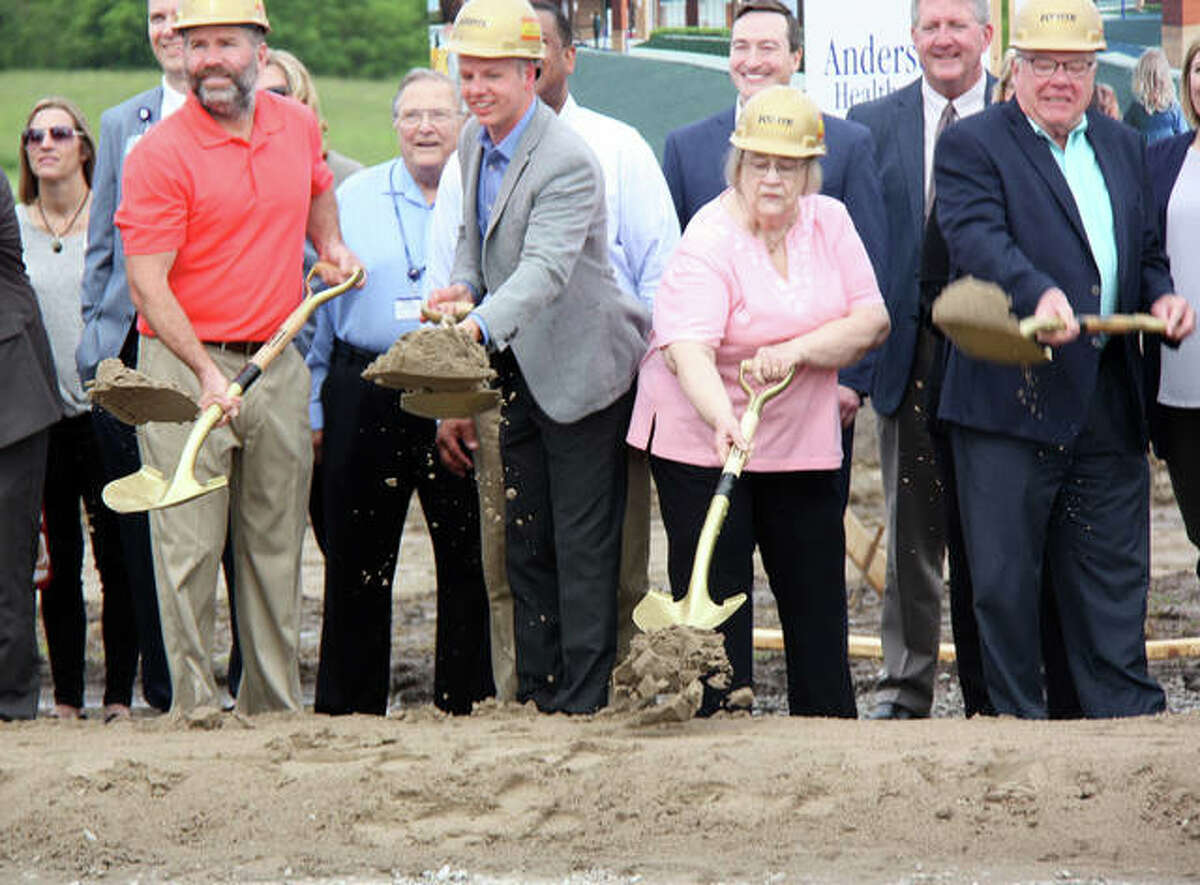 Sand filled in for dirt, which was mud Thursday during Anderson Healthcare’s Goshen Campus expansion groundbreaking. City officials joined Anderson, YMCA and other officials for the ceremony. From left are Mayor Hal Patton, Alderman SJ Morrison, Alderman Janet Stack and Alderman Jack Burns.