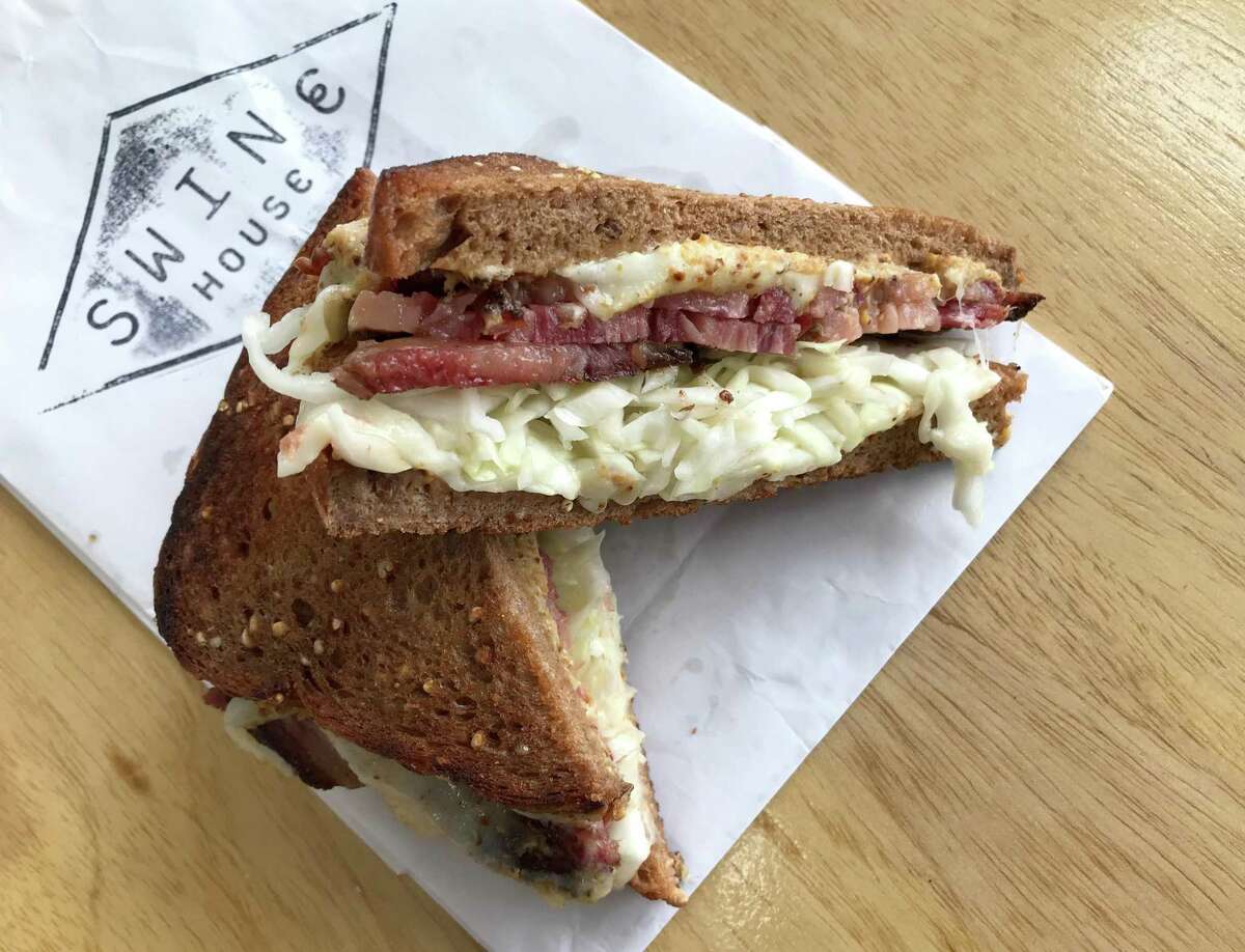A pastrami, sauerkraut and cheese sandwich from Swine House Bodega, which is located at 124 N. Main Ave. in downtown San Antonio.