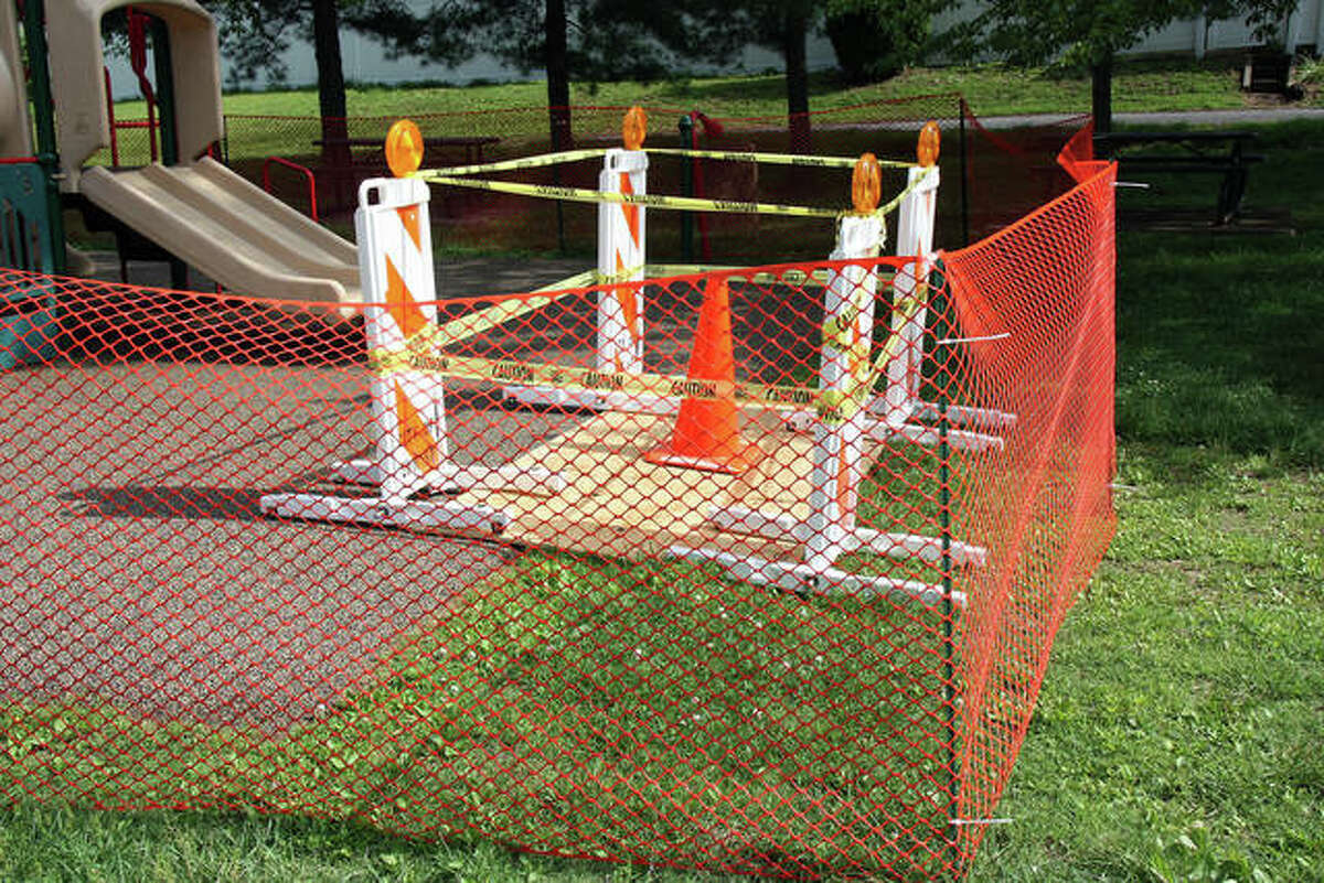Barricades and safety fencing keep children and parents away from the Rotary Park playground in the wake of Tuesday’s storm. City officials have not said when the park will re-open.