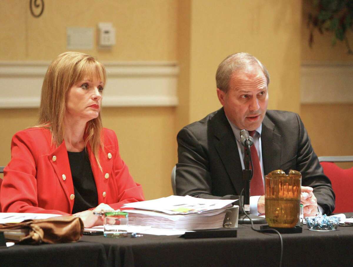 Norrell, who has been with the township since 2006, is shown here in this Villager archive photograph with former township board member Nelda Luce Blair, left, listening to resident's concerns during a town hall meeting at the Waterway Marriott in 2014.