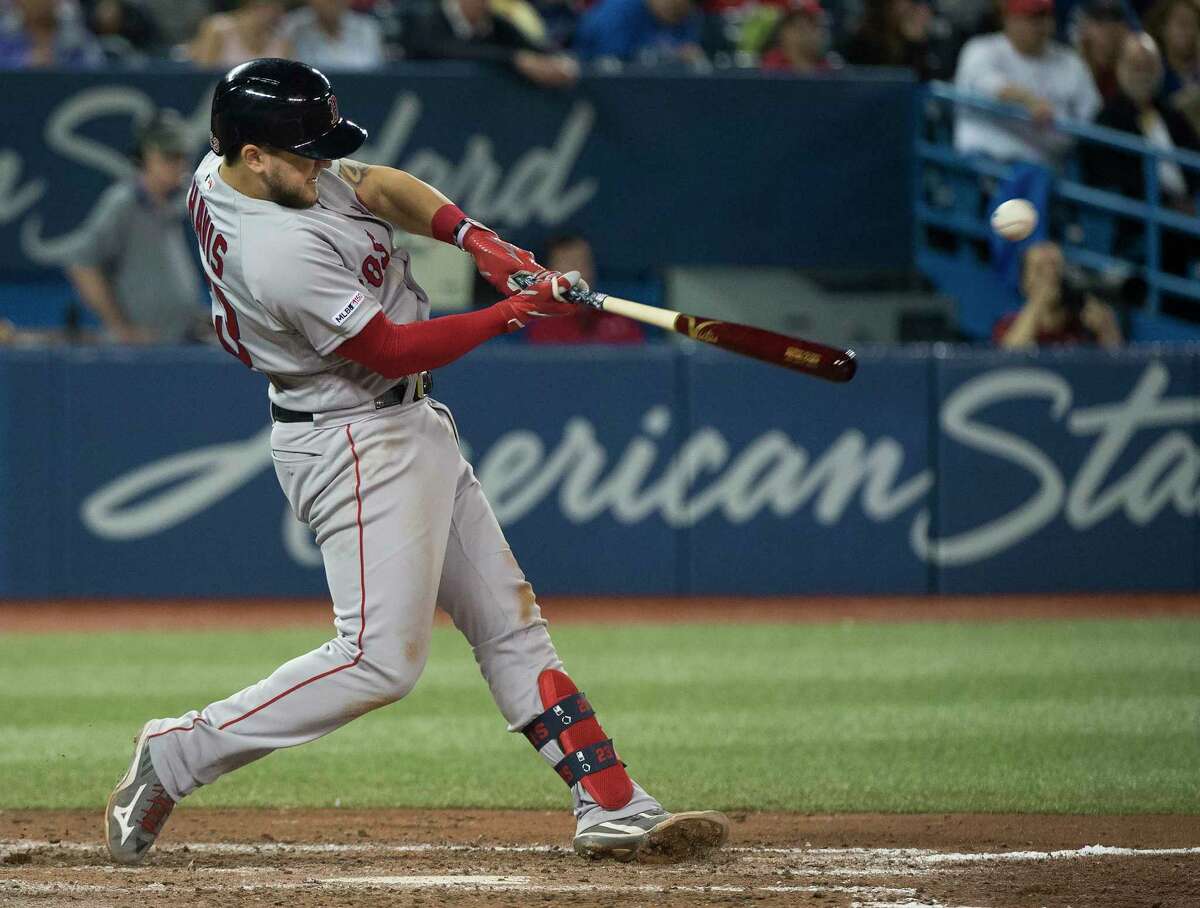 Boston Red Sox's Michael Chavis hits a single against the Toronto Blue Jays during the seventh inning of a baseball game in Toronto, Thursday, May 23, 2019. (Nathan Denette/The Canadian Press via AP)