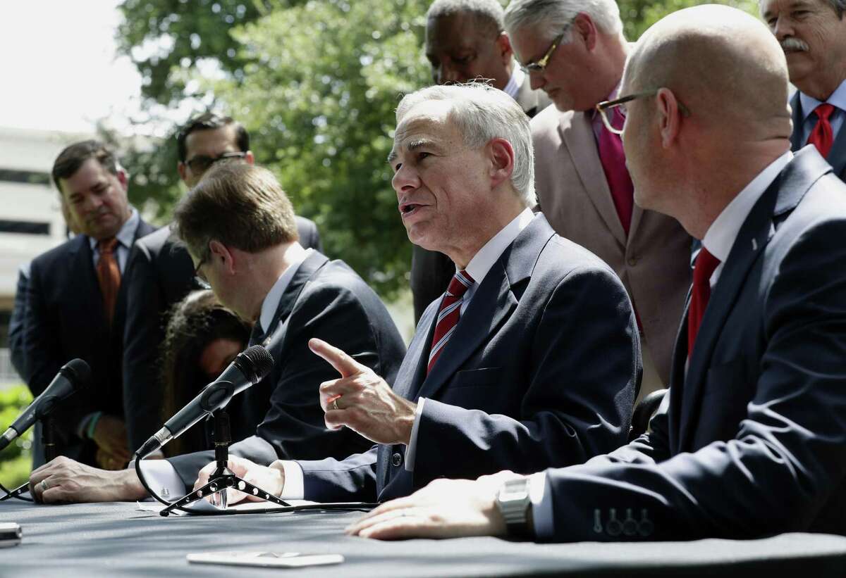 Gov. Greg Abbott, center, is joined by Lt. Gov. Dan Patrick, left, and Speaker of the House Dennis Bonnen, right, and other law makers for a joint news conference to discuss teacher pay and school finance at the Texas Governor's Mansion in Austin, Texas, Thursday, May 23, 2019, in Austin. (AP Photo/Eric Gay)