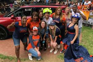 Sharon Russ, of Beaumont (far left), won a 2019 Chevrolet Trailblazer during a taping of 'The Ellen DeGeneres Show' at Minute Maid Park Thursday. Also competing was Jennifer Walsh (far right), wearing a custom gown made by a Lumberton seamstress.
