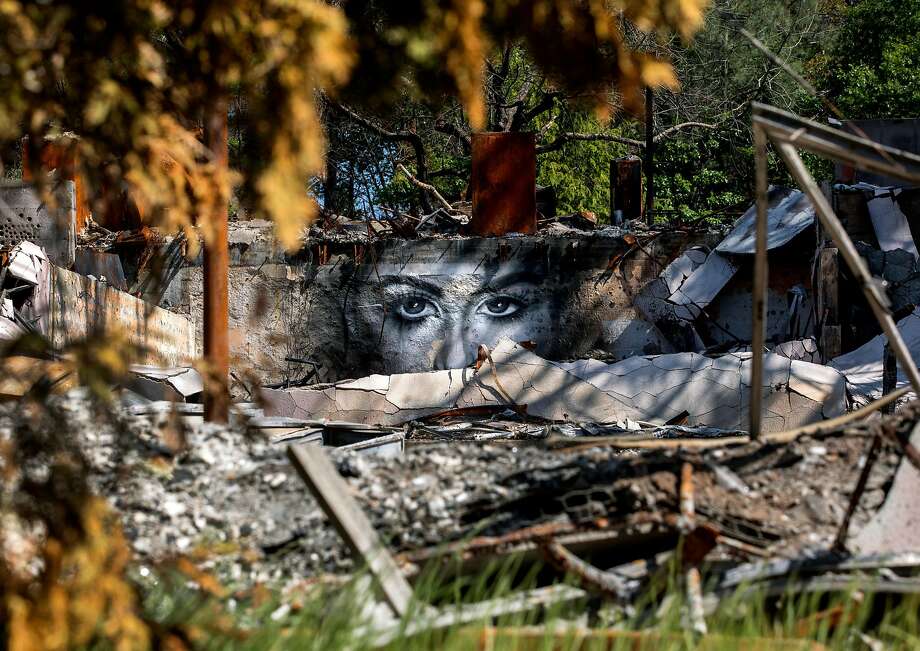A mural painted by artist Shane Grammer is seen on the wreckage of Seventh-Day Adventist Church destroyed by last year's Camp Fire in Paradise, Calif. Saturday, May 4, 2019. Photo: Jessica Christian / The Chronicle