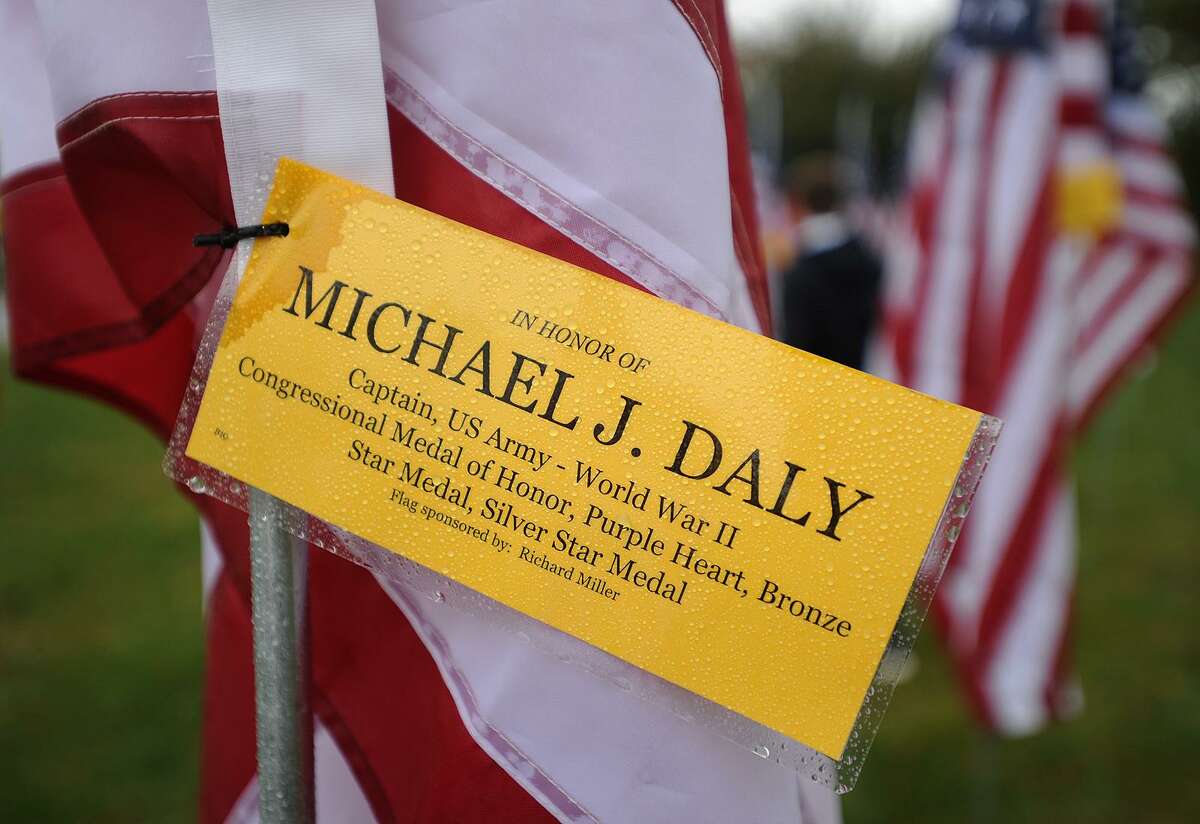 Individual flags are dedicated in the names of veterans, including World War 2 Medal of Honor winner Michael J. Daly, at Field of Valor, a display of 110 American flags at Jennings Park on the Post Road in Fairfield, Conn. on Sunday, November 5, 2017. The display, which Kiwanis plans to continue as an annual event, had an opening ceremony at 1 p.m. on Sunday.