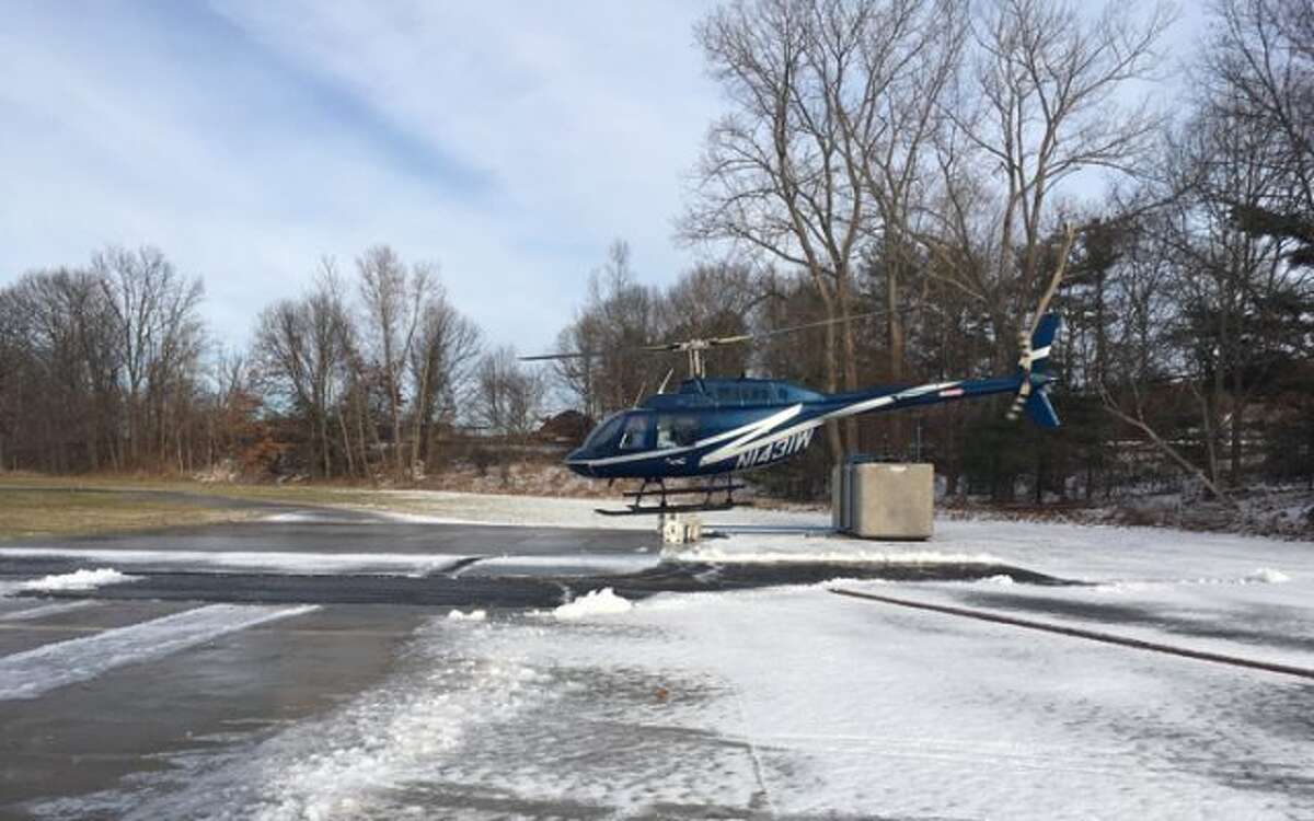 Blue & silver helicopter, tail # N1431W